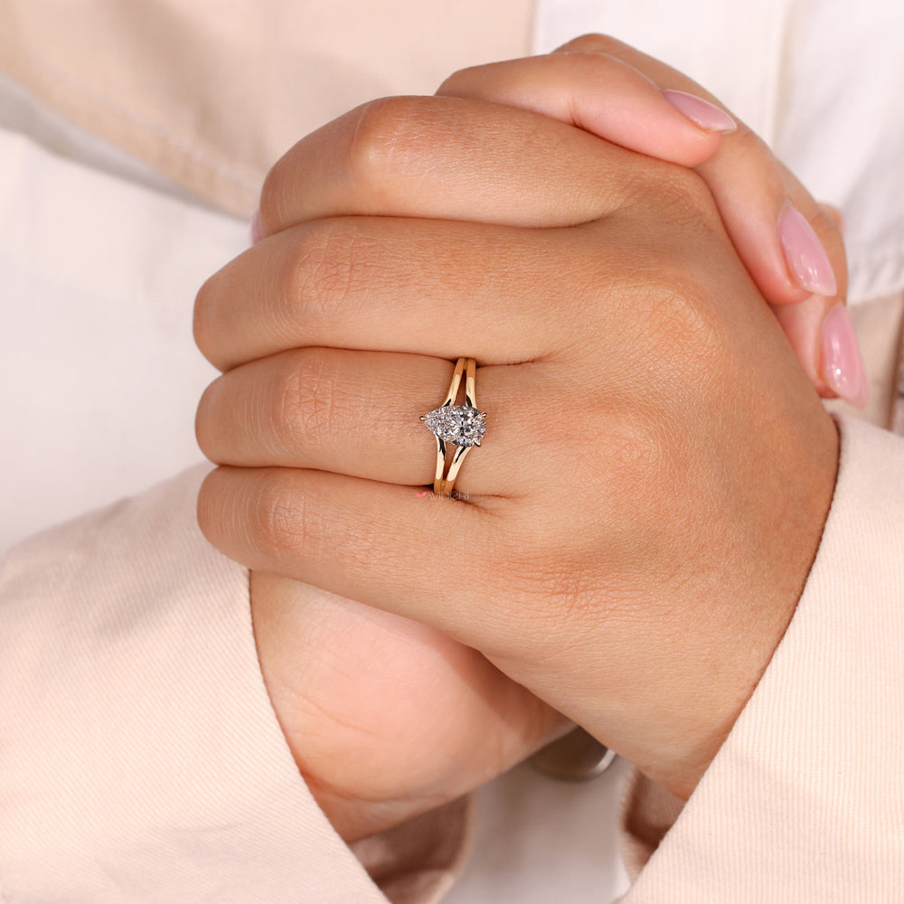Hidden halo diamond ring with a split shank pear engagement ring design, highlighting handmade ring craftsmanship.
