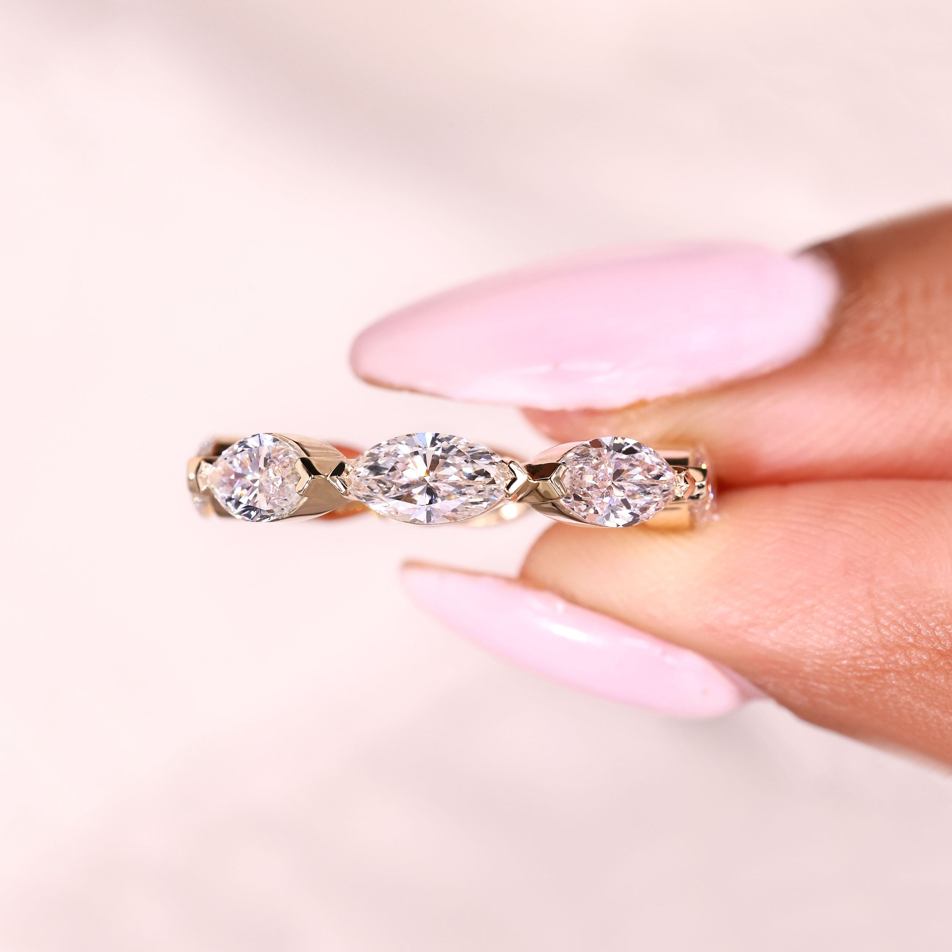 Marquise eternity ring with evenly spaced V prong settings
