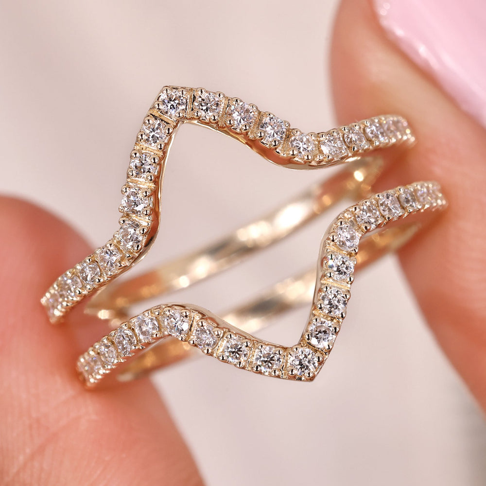 Round diamond wedding band in yellow gold.