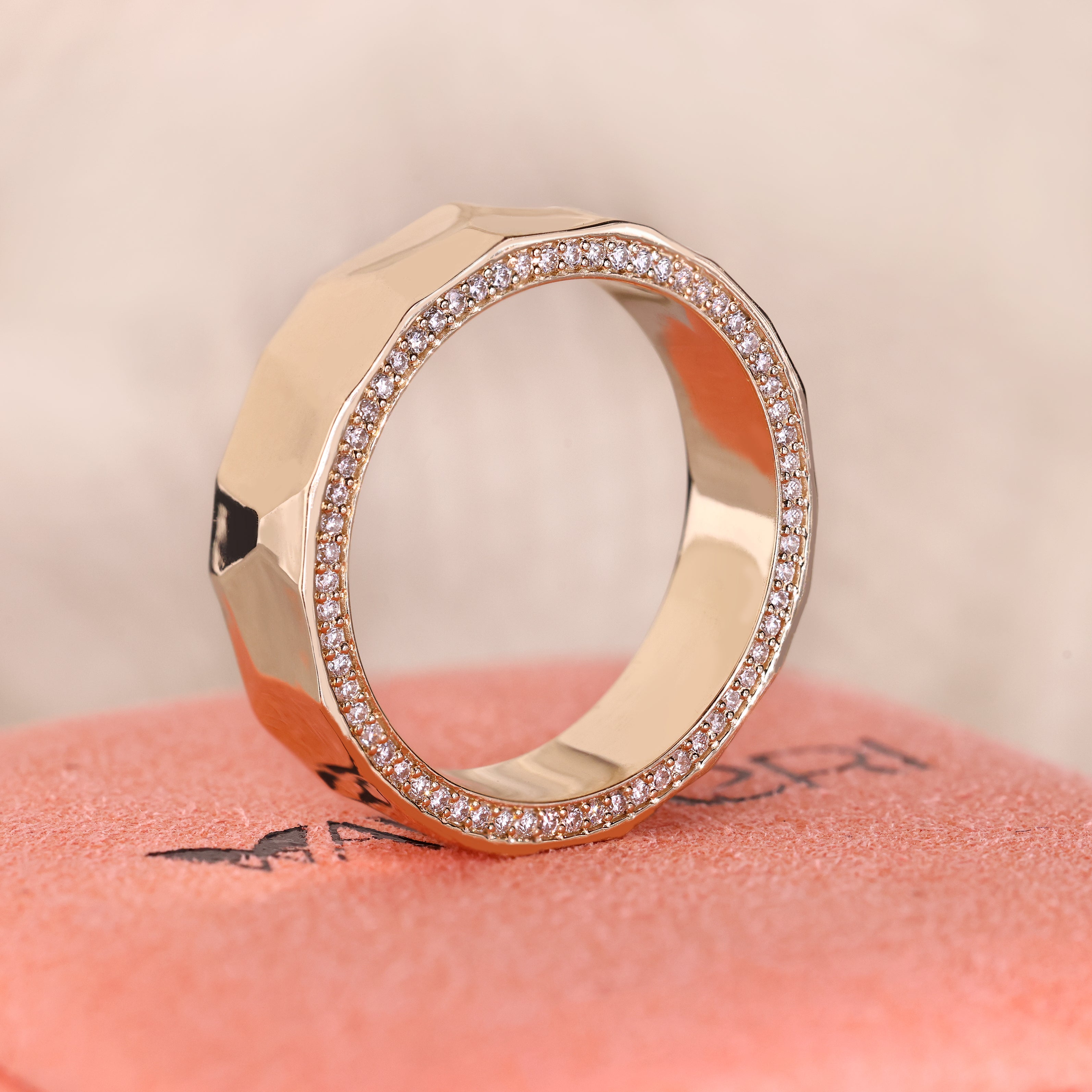 ammered finish wedding band with round double side diamonds.
