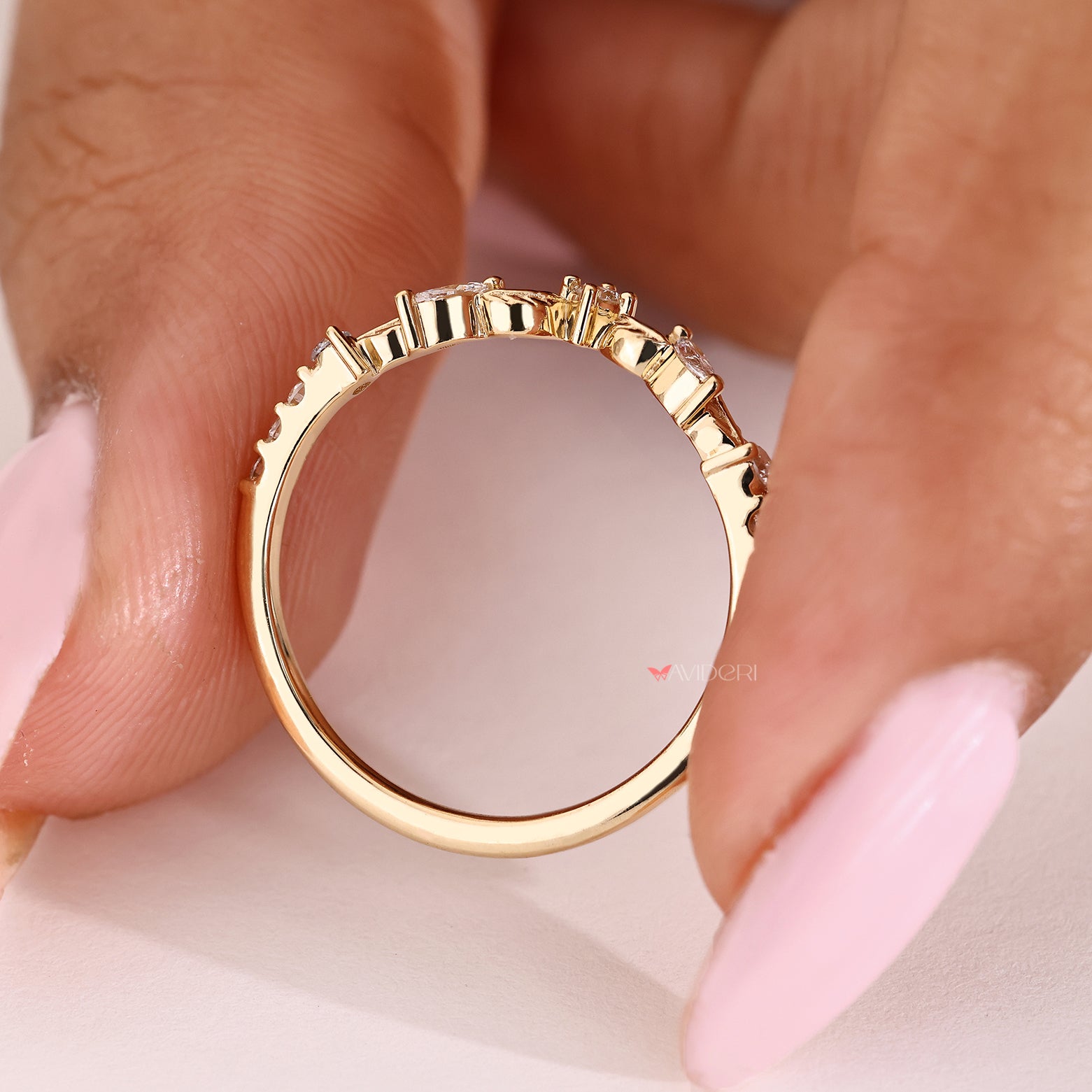 Nature style wedding band with marquise and round diamonds
