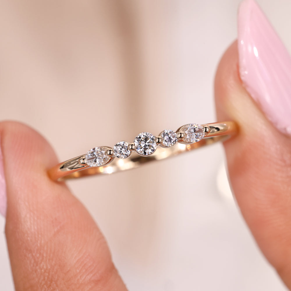 Shared prong wedding band with oval diamond band.