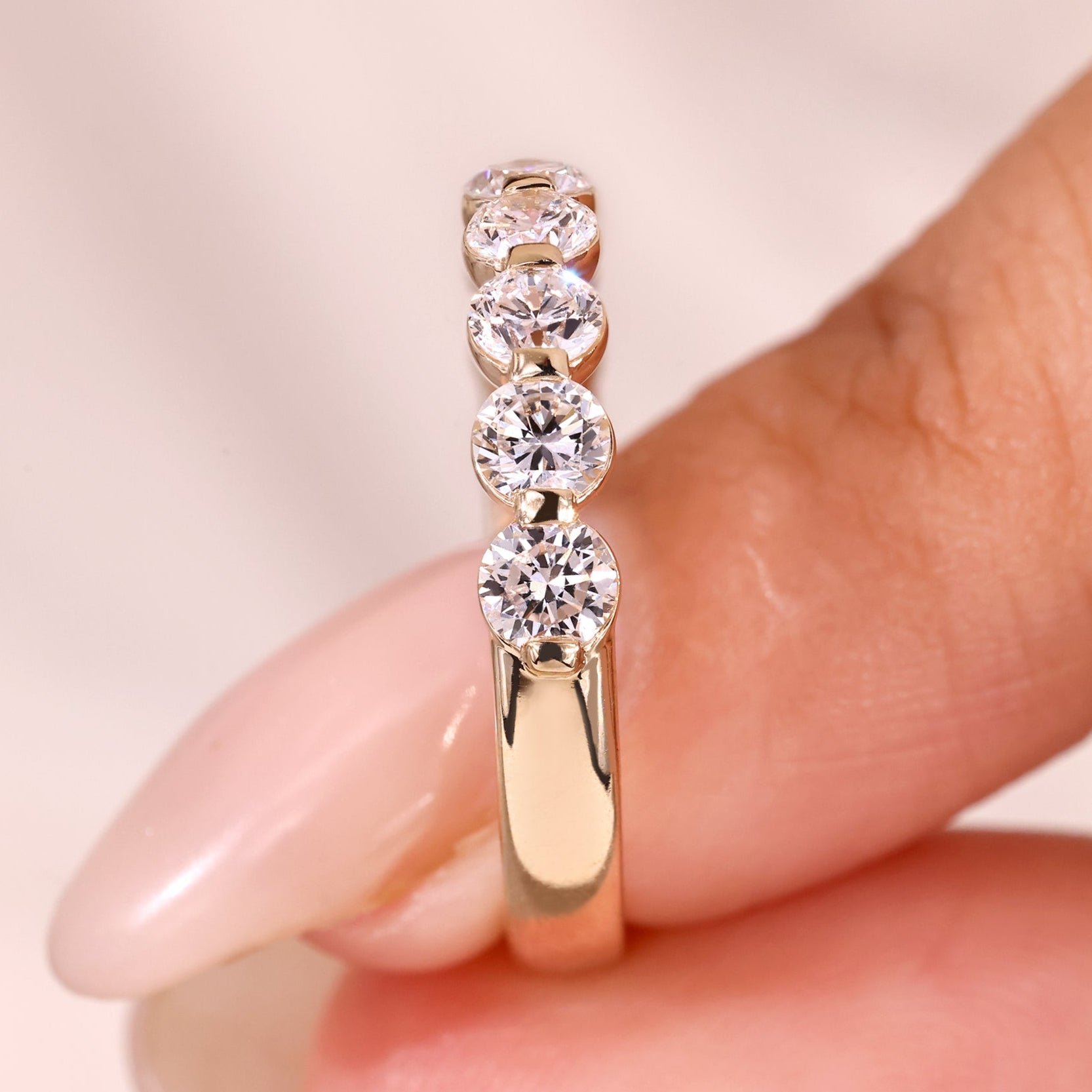 Round diamond wedding band with yellow gold wedding band.