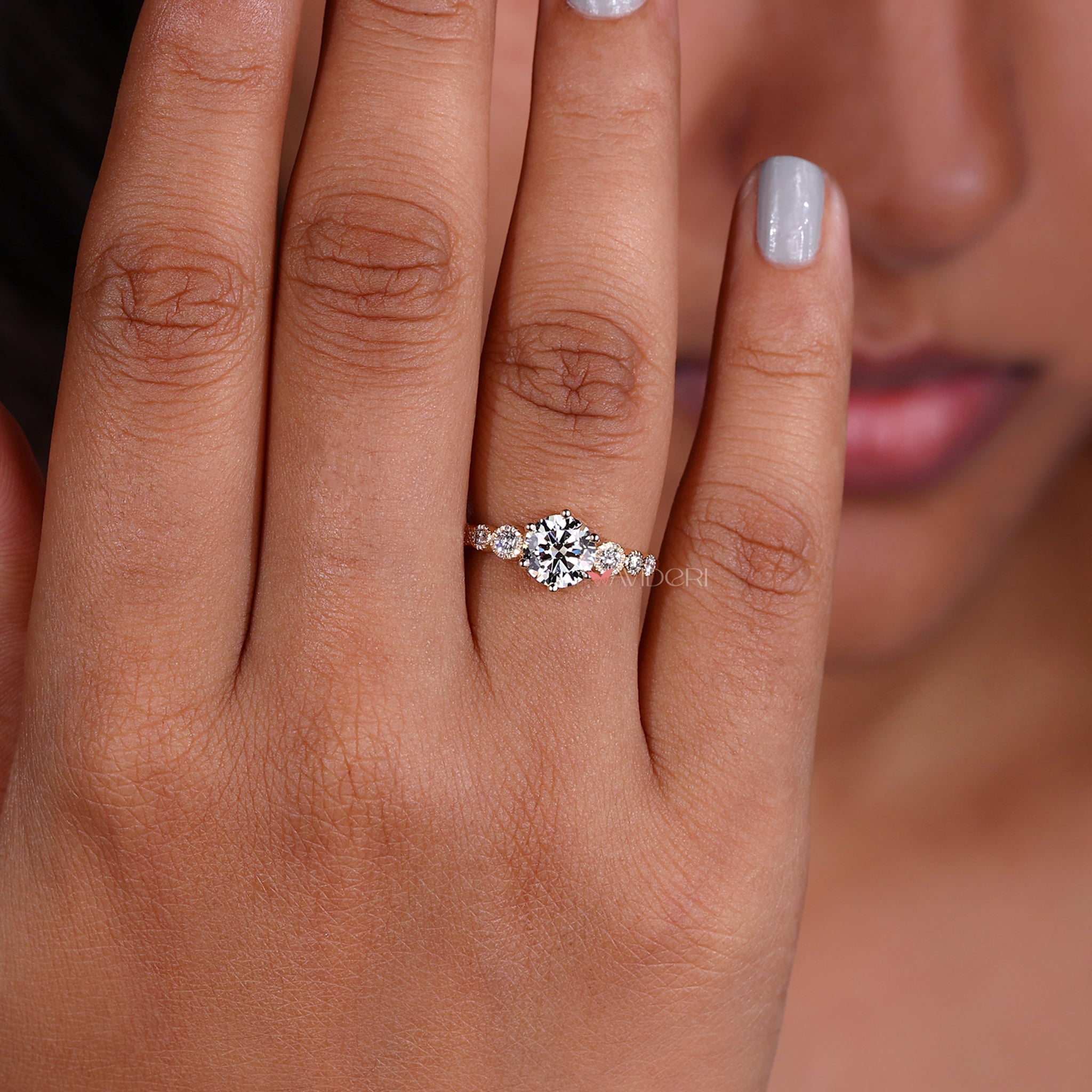 Handmade jewelry showcasing a 6 prong round engagement ring with a rounded diamond in a classic gold finish.
