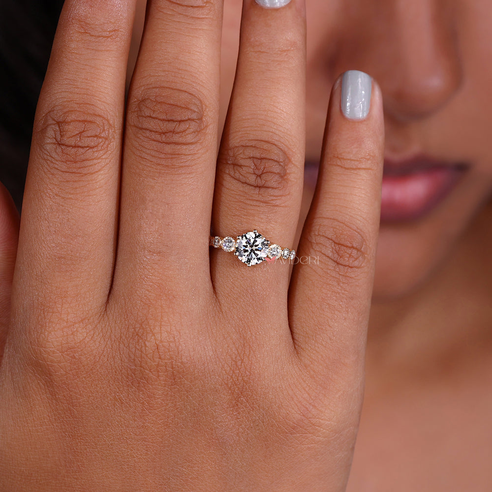 Handmade jewelry showcasing a 6 prong round engagement ring with a rounded diamond in a classic gold finish.
