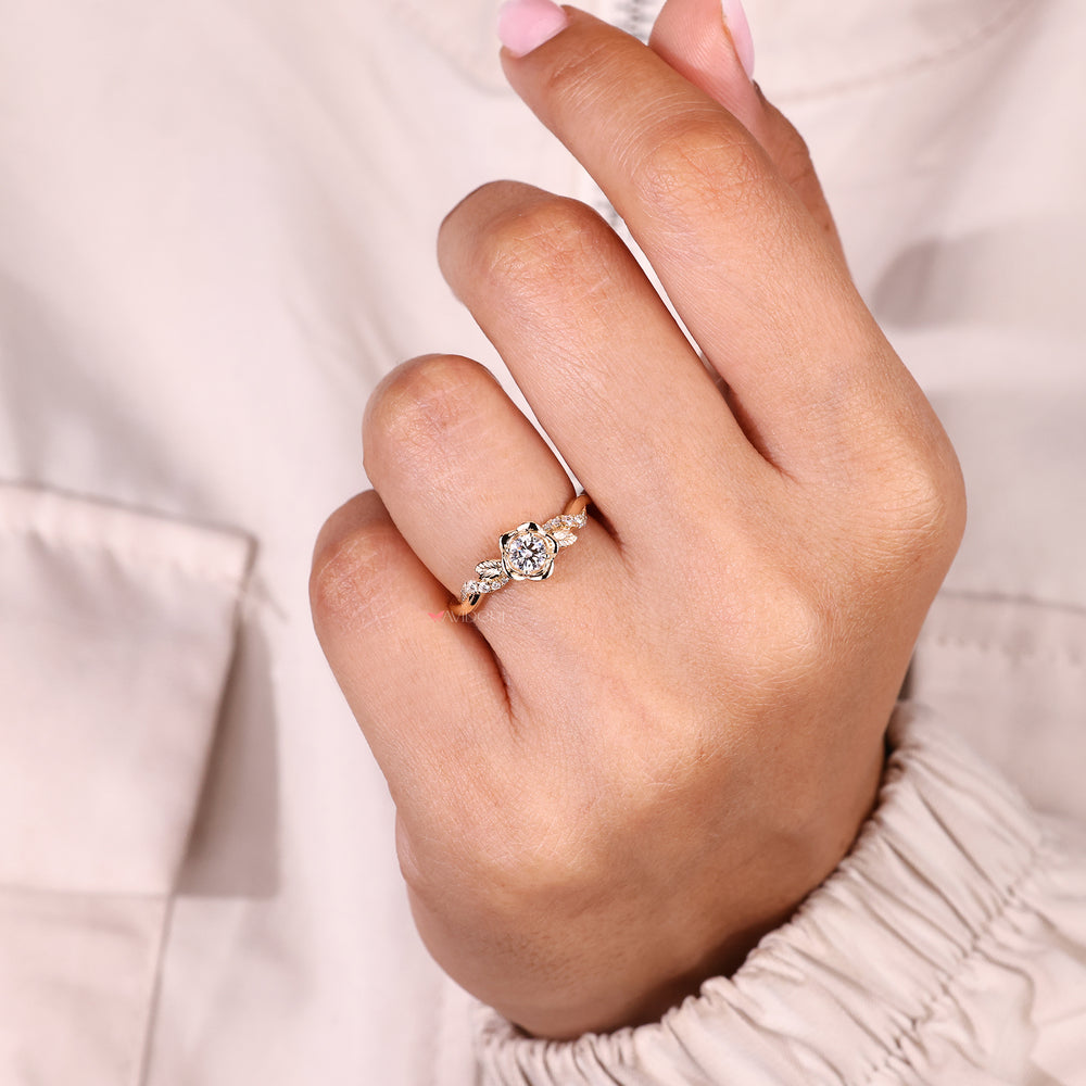 Handcrafted engagement ring with a brilliant round diamond in a floral setting.