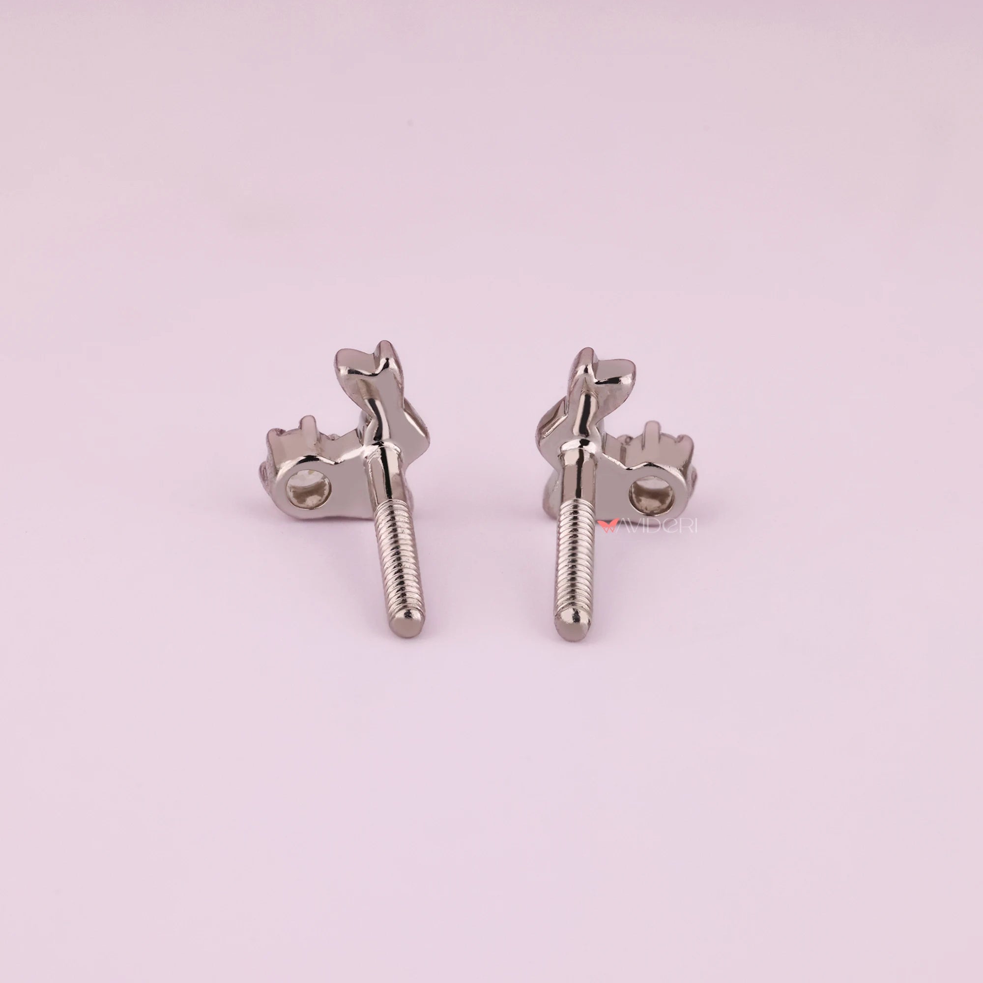 Handmade earrings in white gold with round cut diamonds.