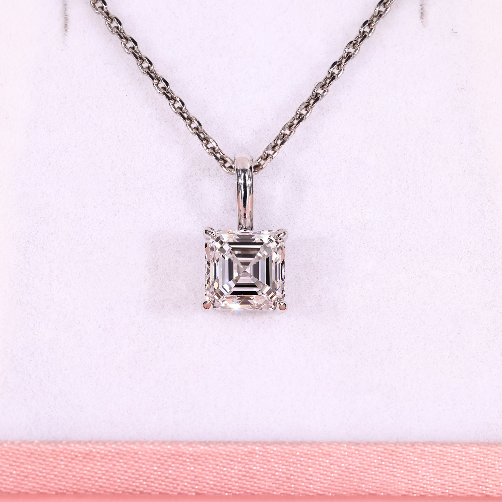 Solitaire diamond pendant with Asscher cut diamond pendant.