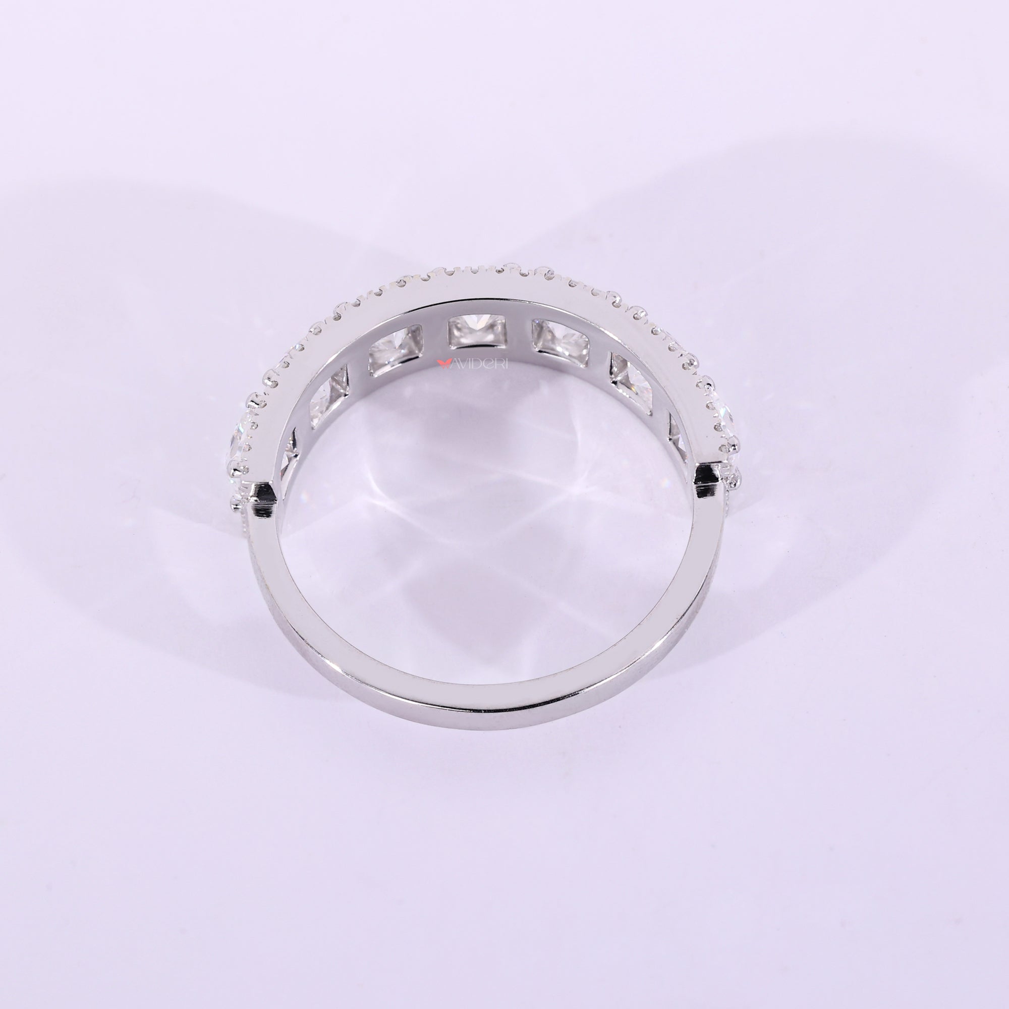 White gold seven stone wedding band with prong setting.