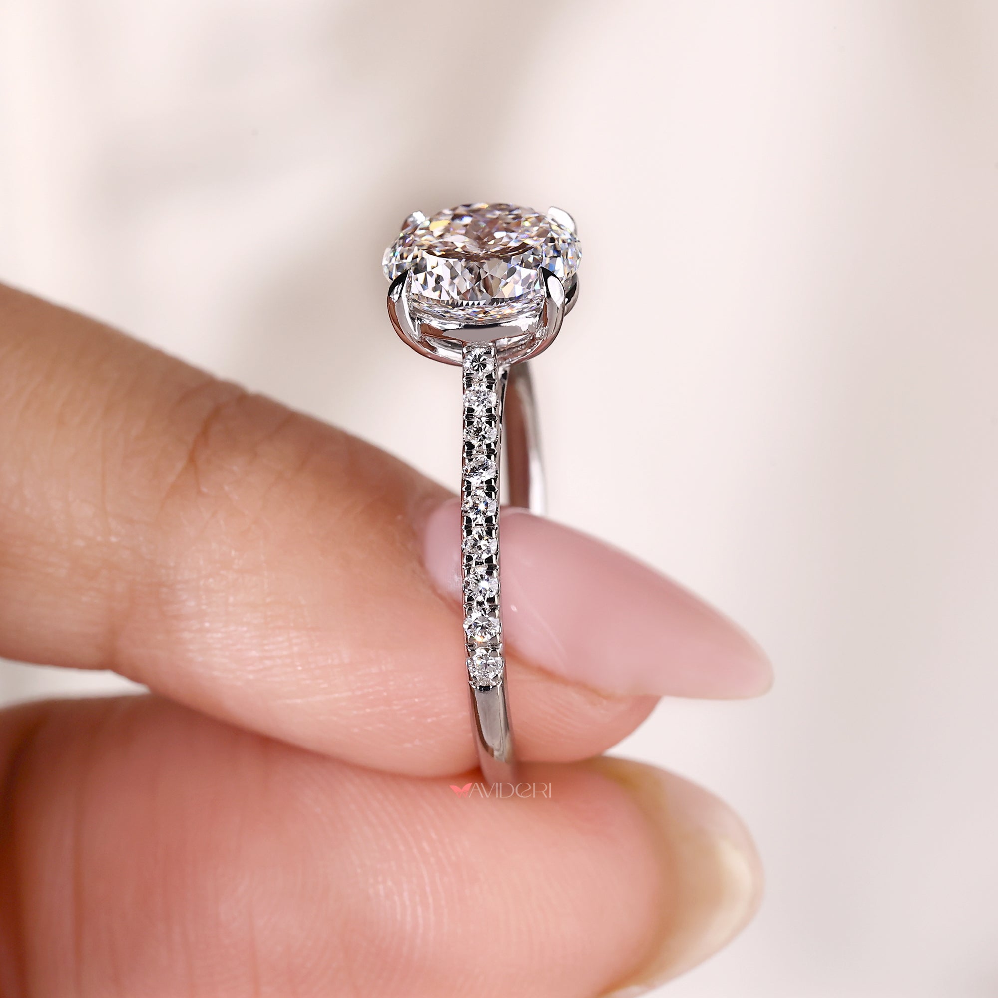 Round cut pave engagement ring with cathedral setting.