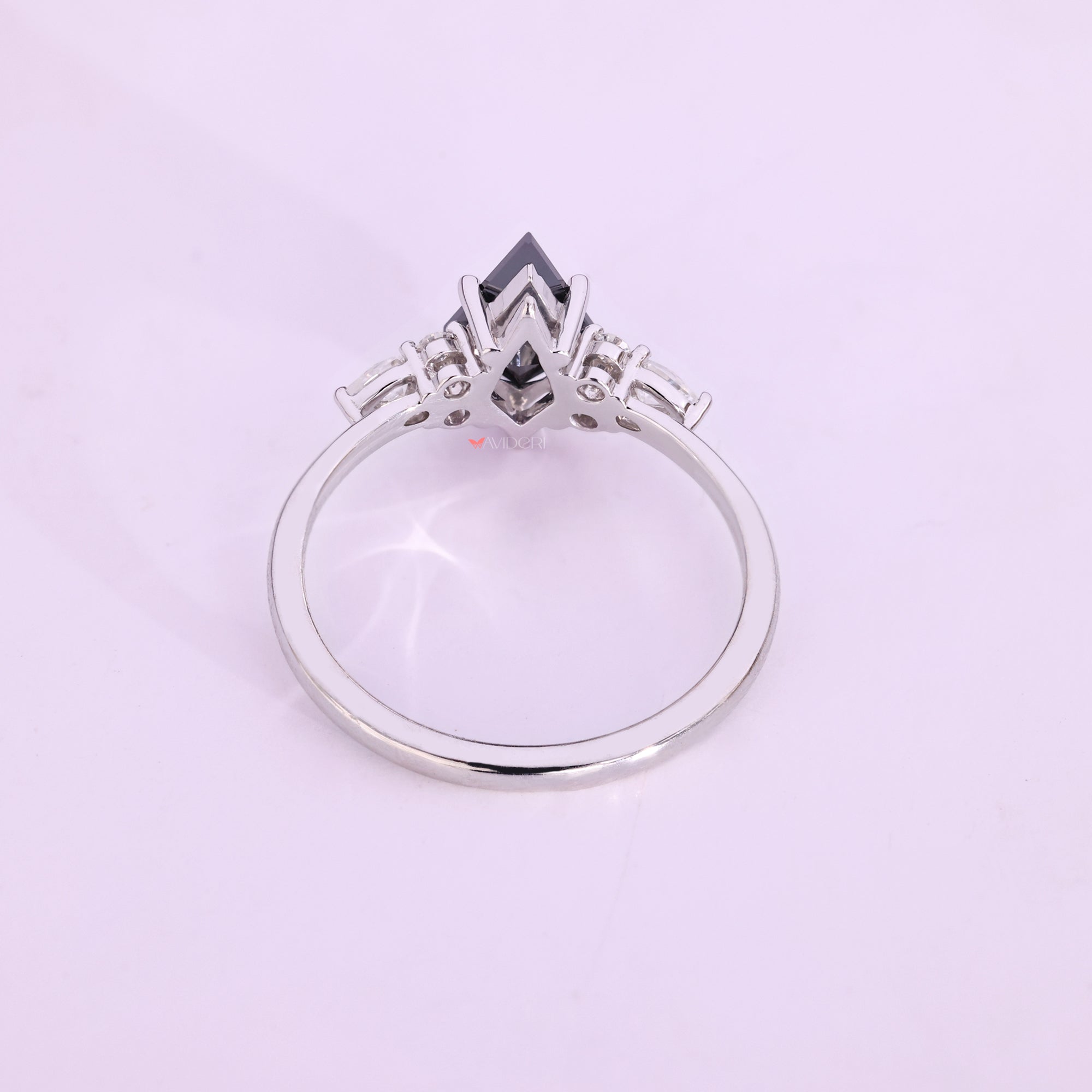 Handmade jewelry piece featuring black Moissanite and white gold.