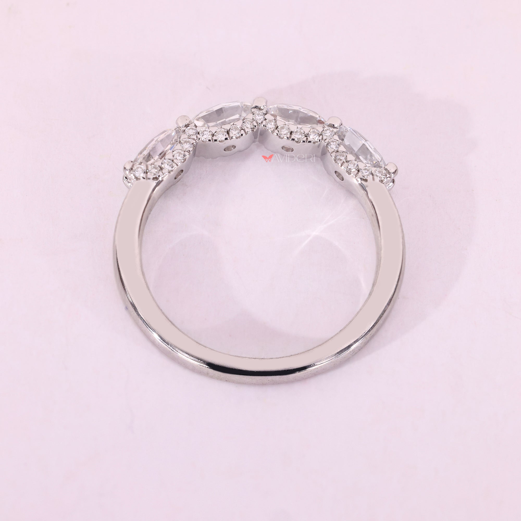 White gold wedding band with oval step cut band.