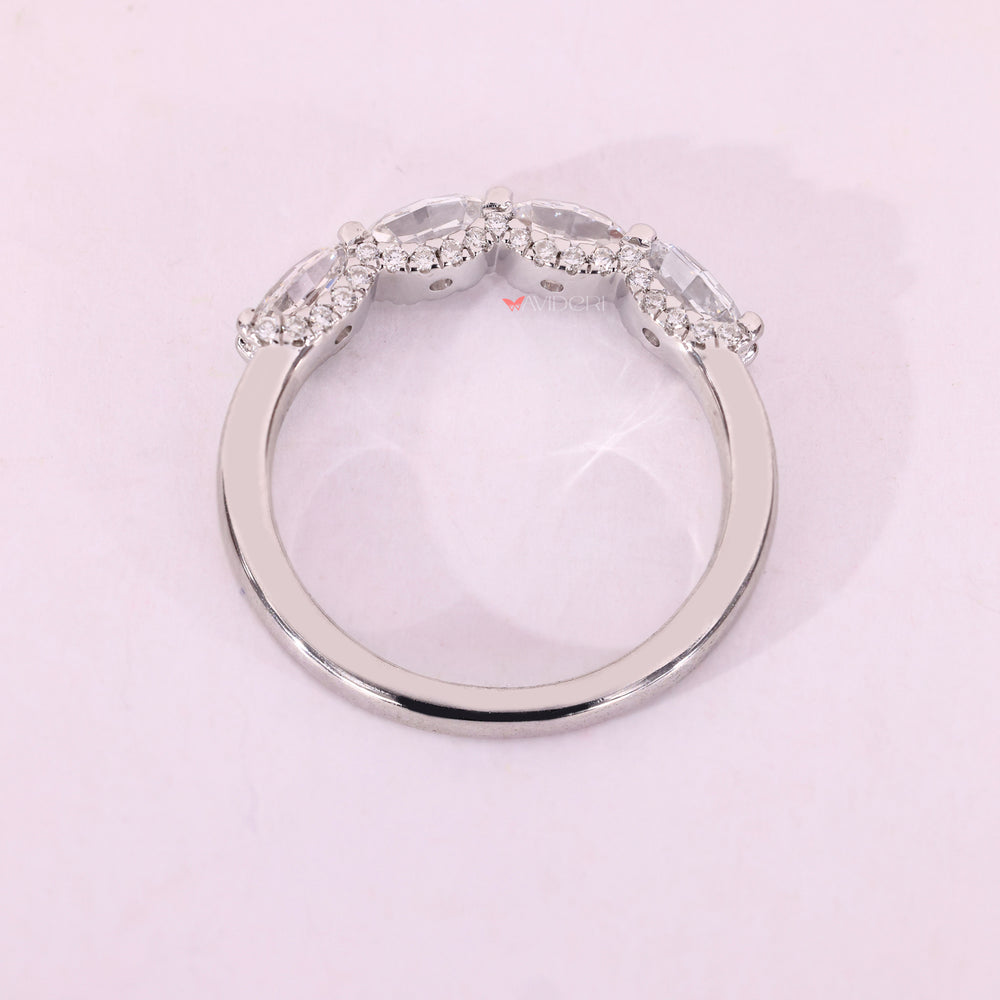 White gold wedding band with oval step cut band.