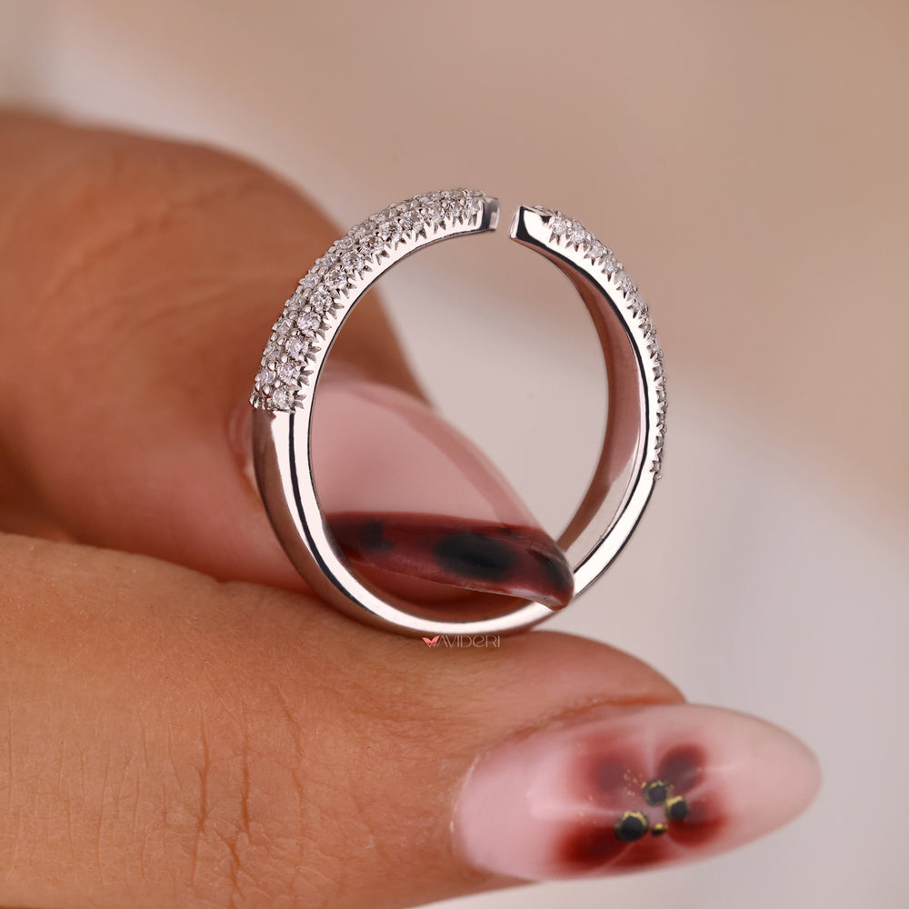 White gold wedding band with round cut diamonds.
