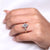 Pear engagement ring with tapered shank design.