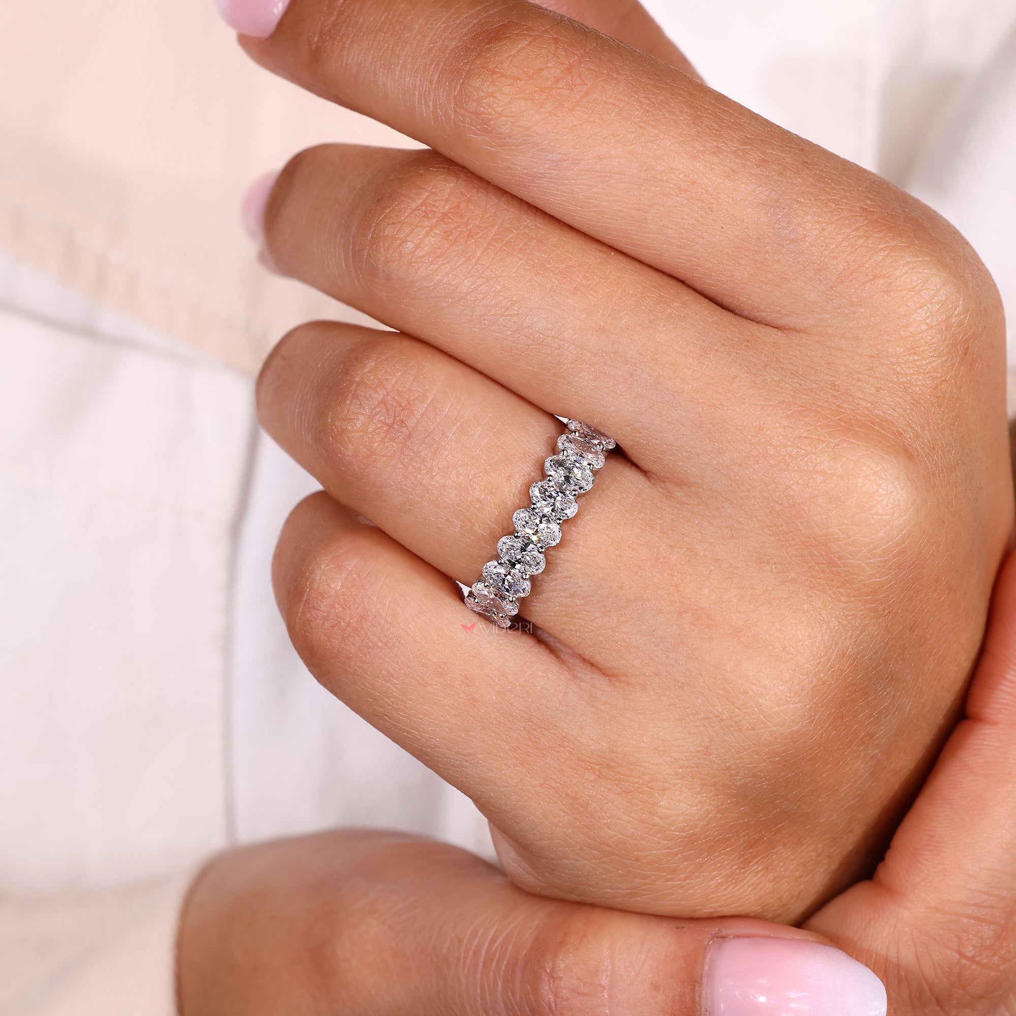 Buy a wedding band with oval stones.