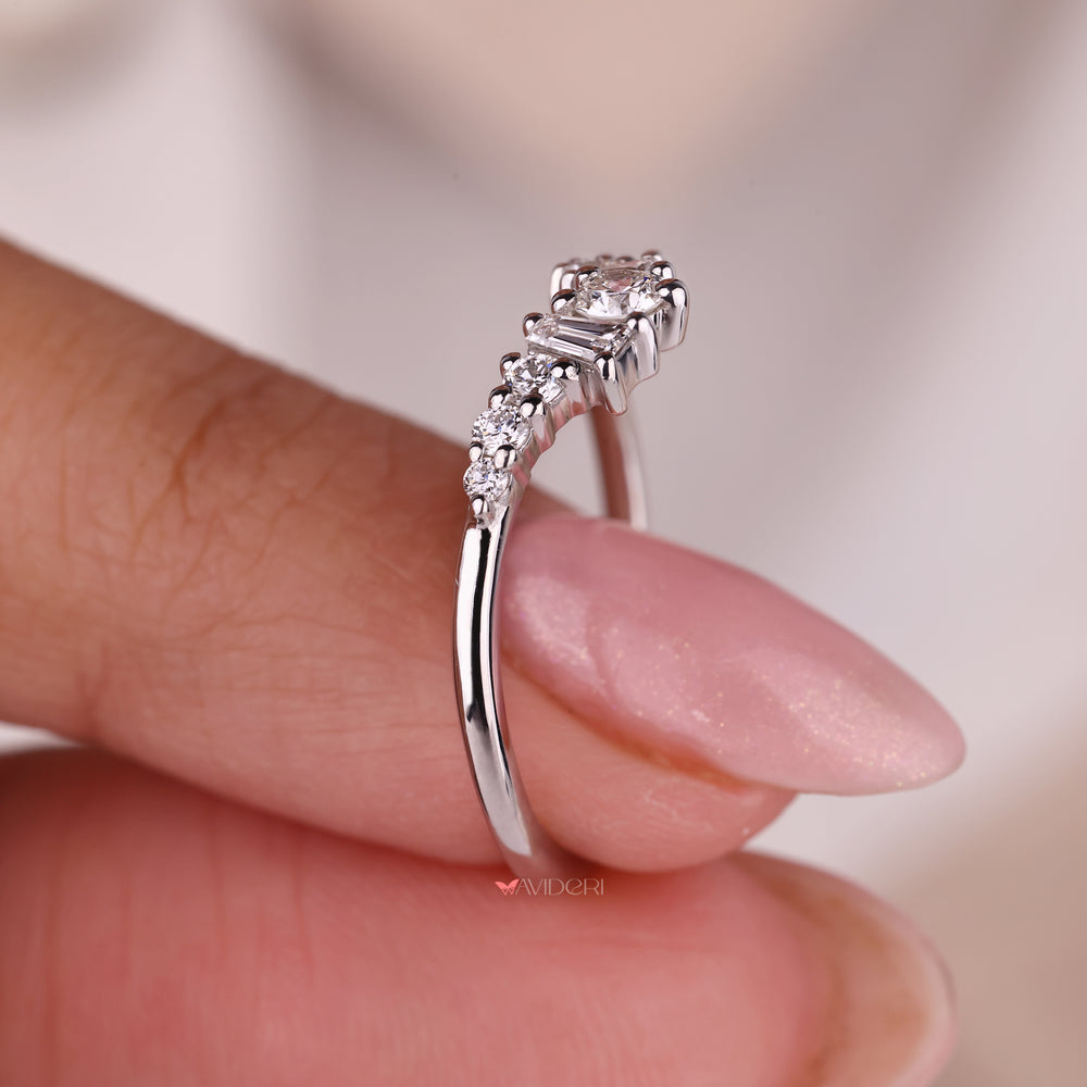 A shared prong wedding band adds brilliance with closely set stones.