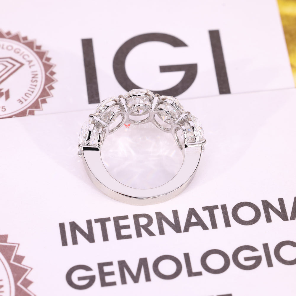 White gold band with oval cut diamond design.