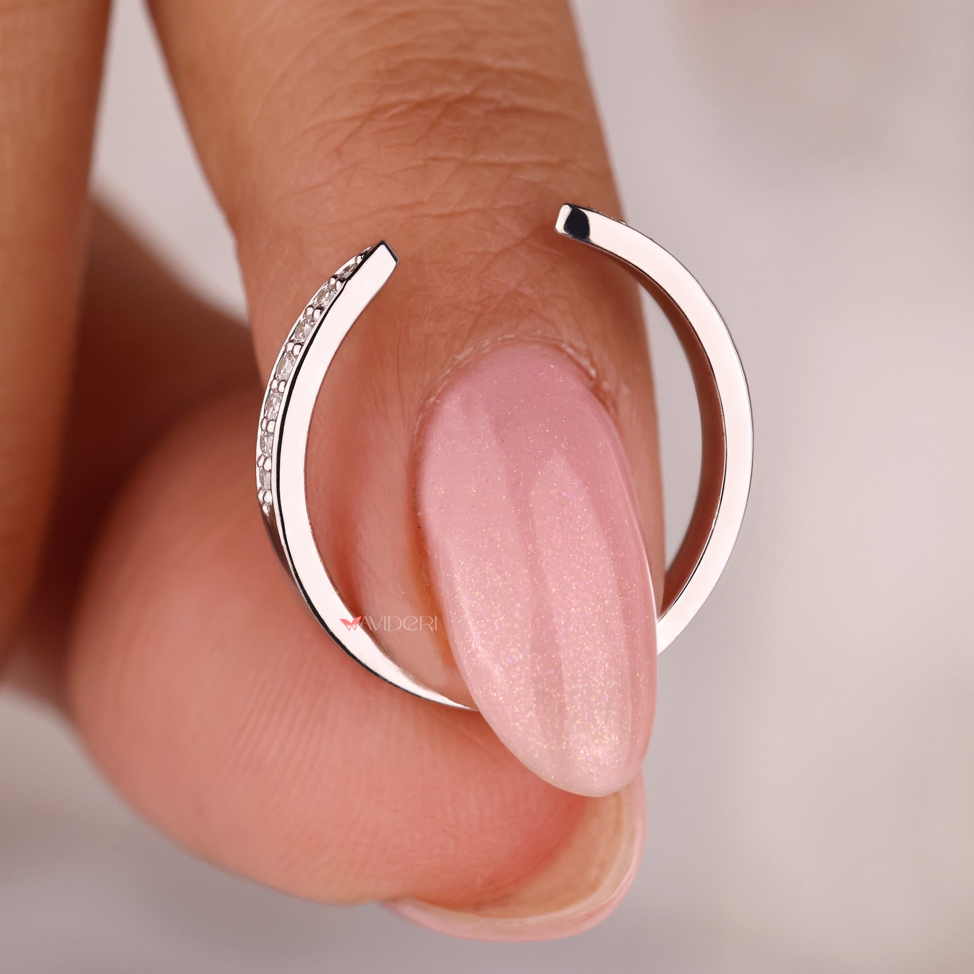 White gold wedding band with lab grown diamond.