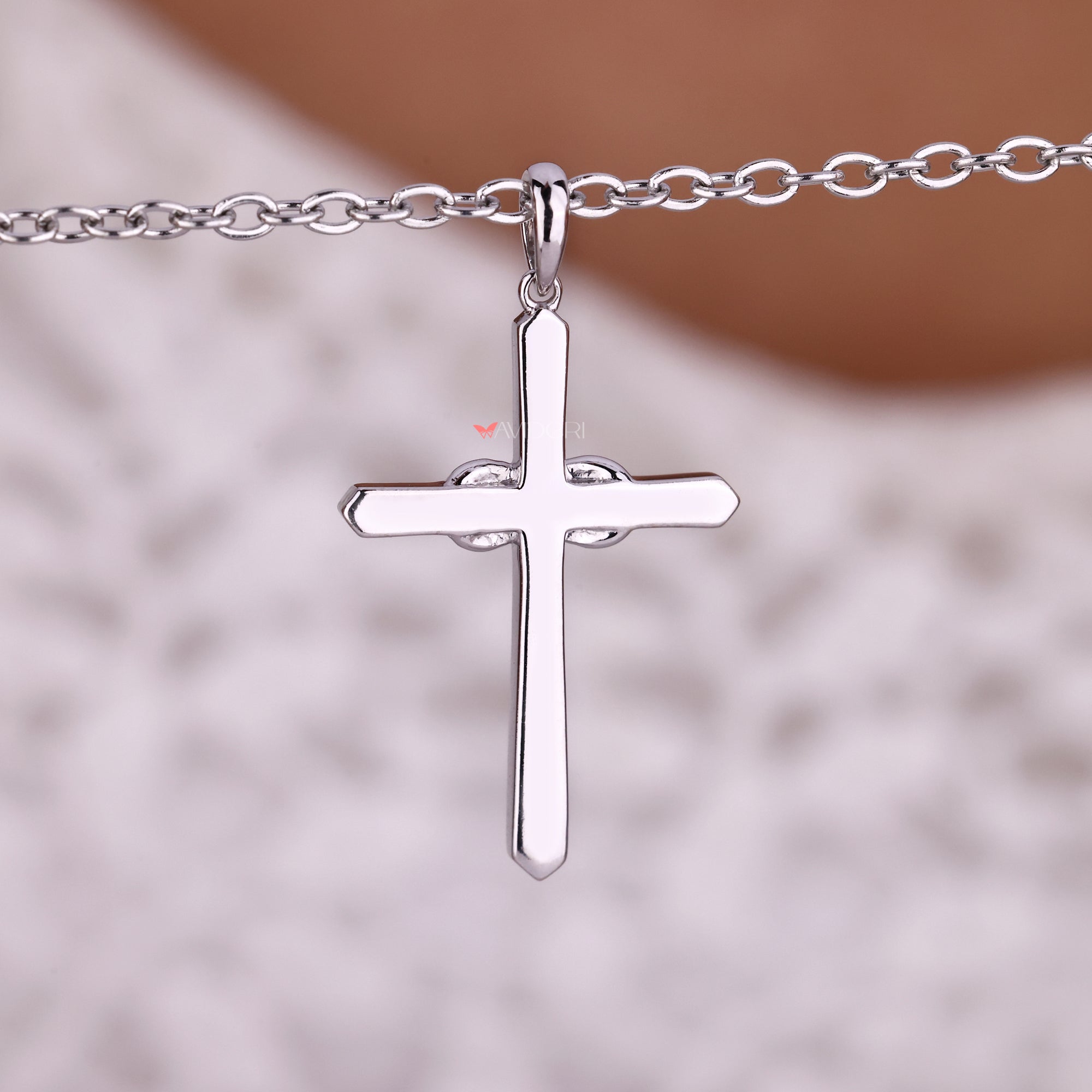 White gold pendant with a diamond cross.