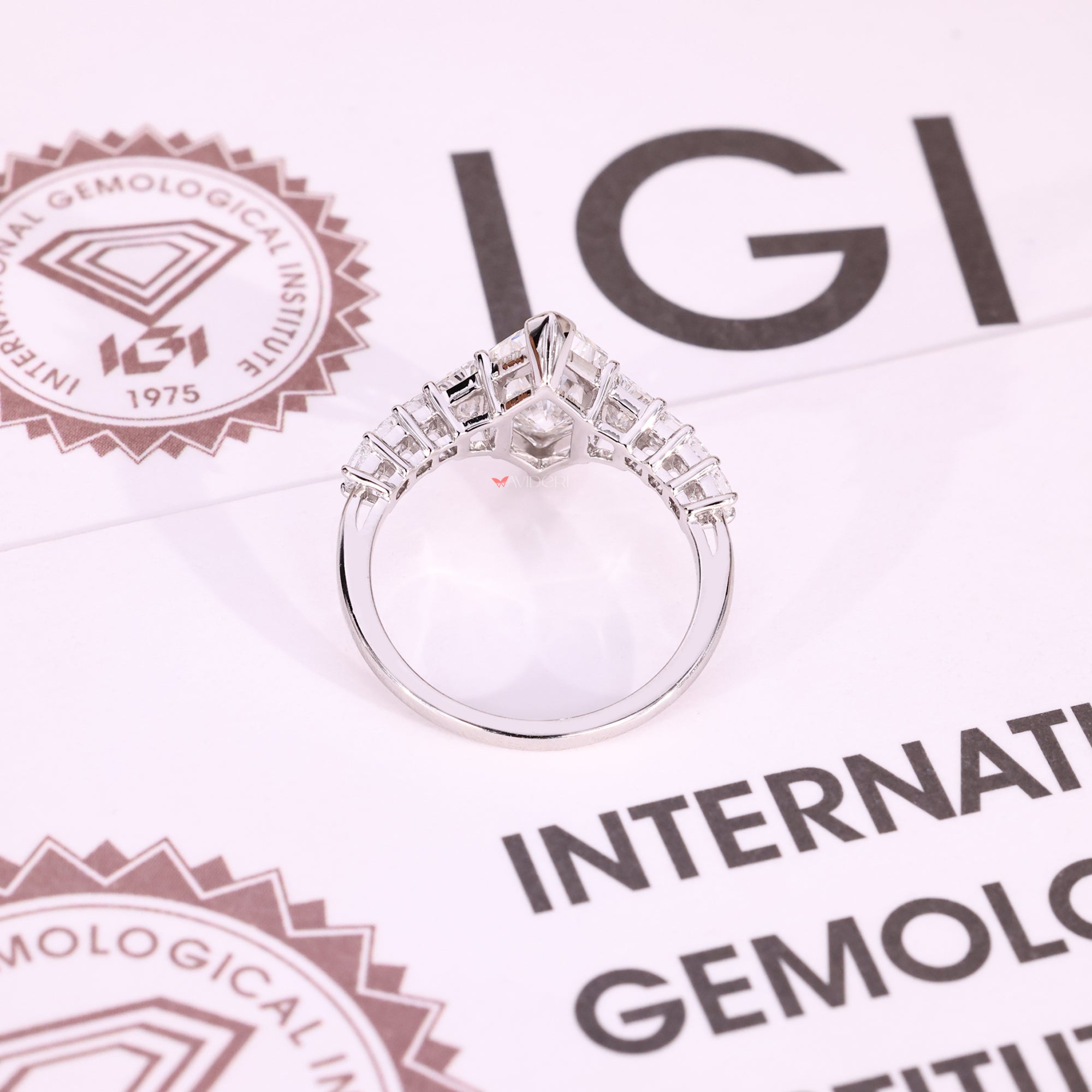 White gold diamond ring with trapezoid side stone.