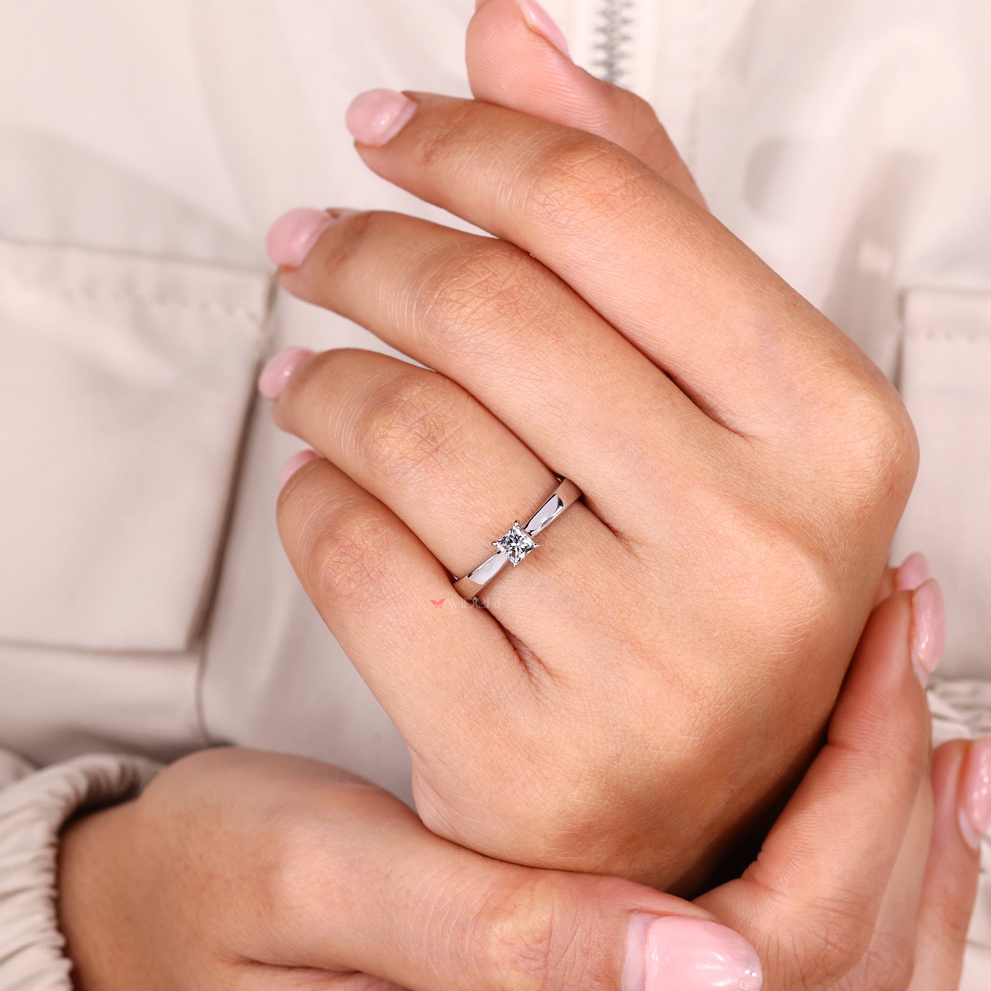 Solitaire engagement ring with princess cut diamond ring.