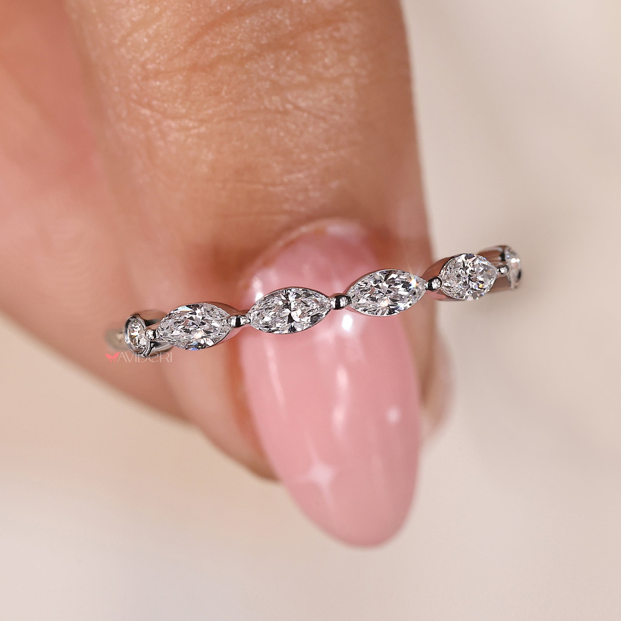 Bezel set ring with marquise diamonds for a sleek and modern style
