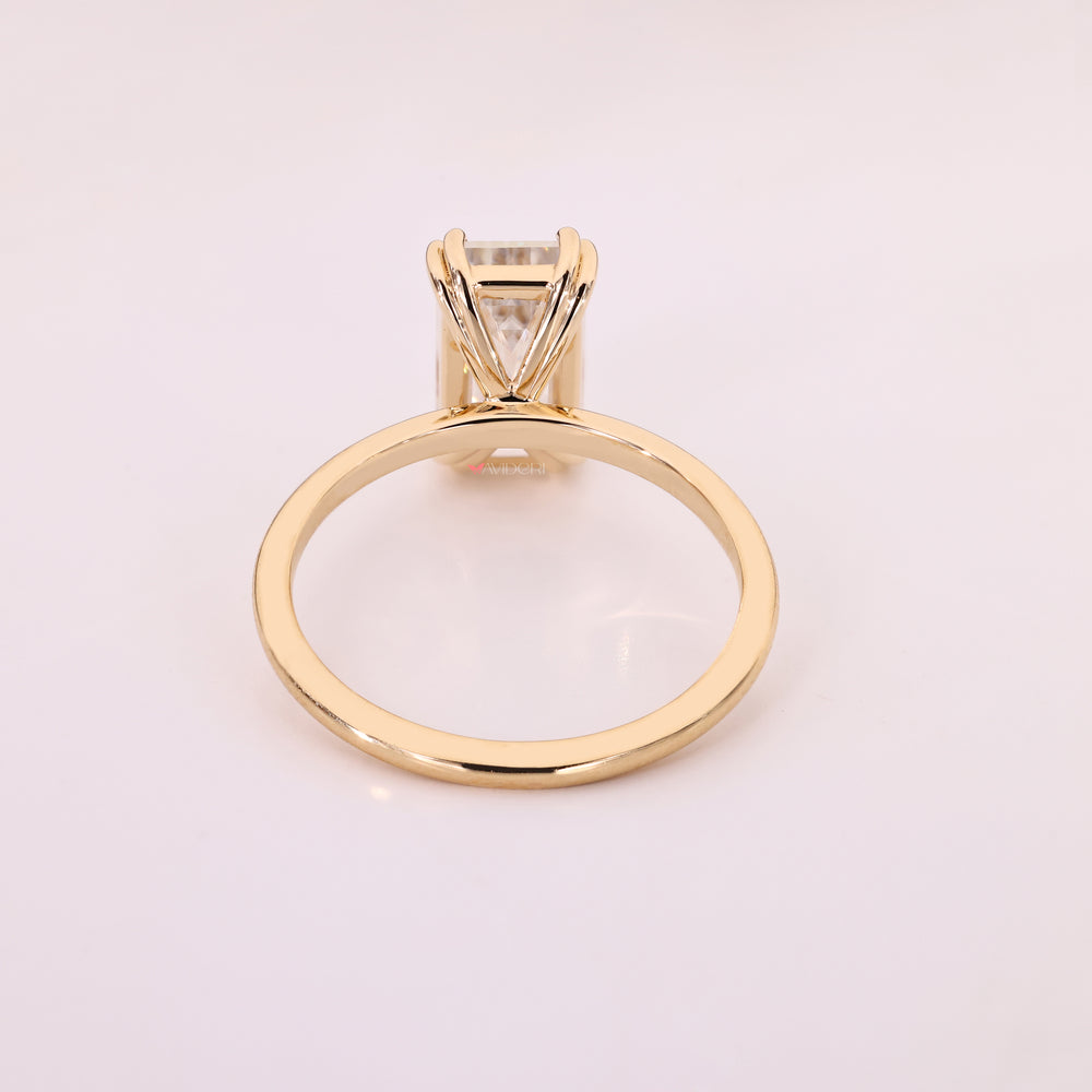 Elegant emerald cut moissanite solitaire ring.

