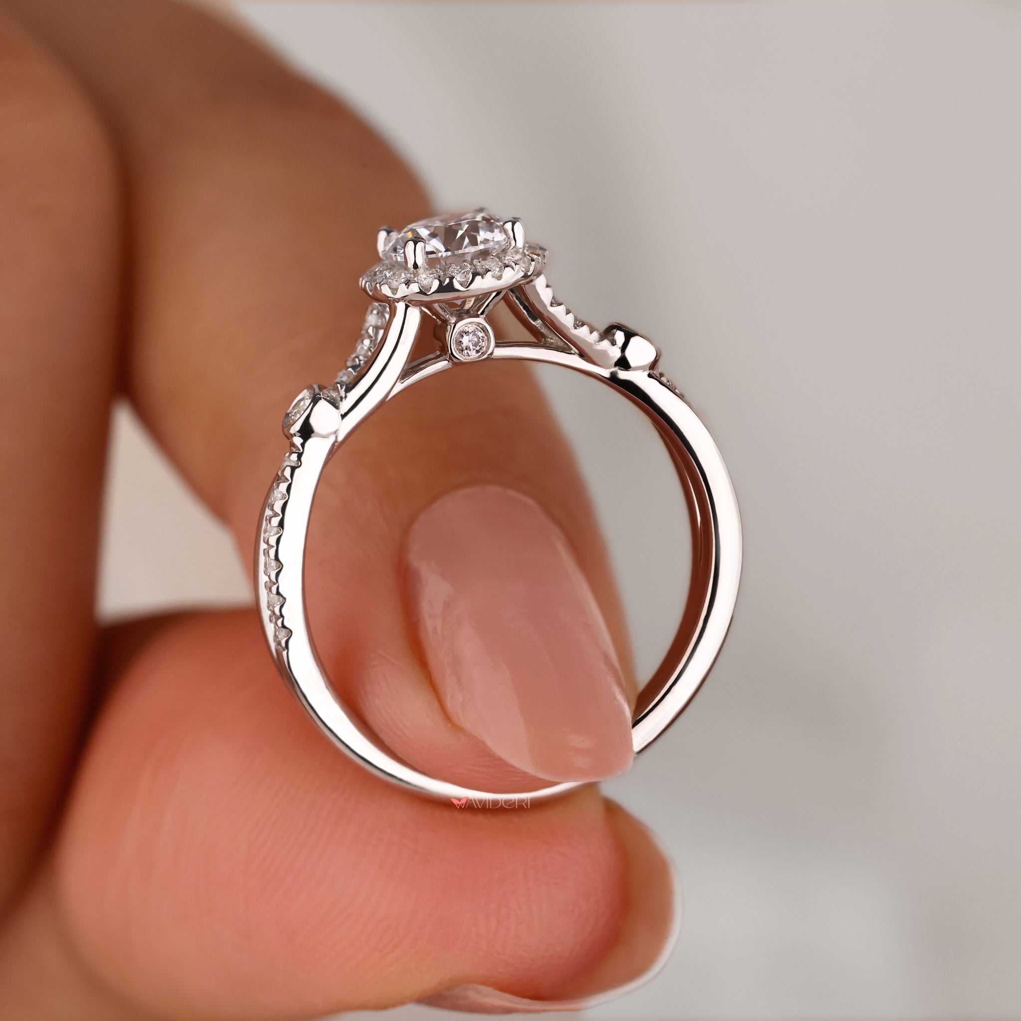 White gold and diamond ring with a twisted engagement ring.
