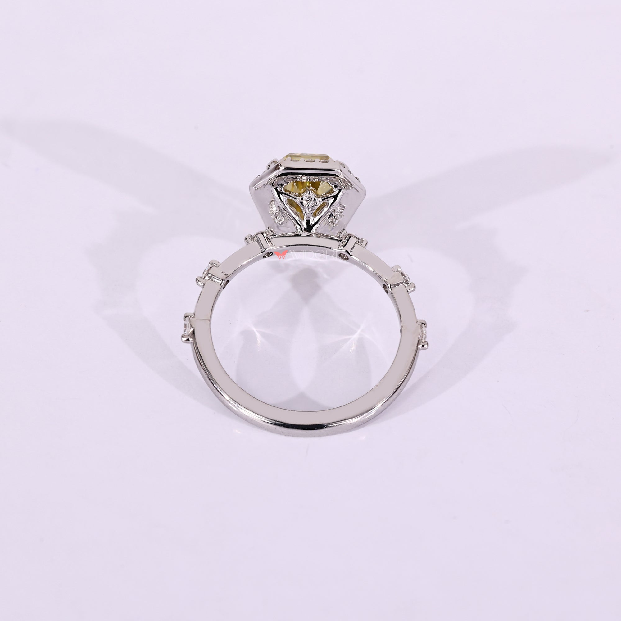 White gold engagement ring with four claw prong.