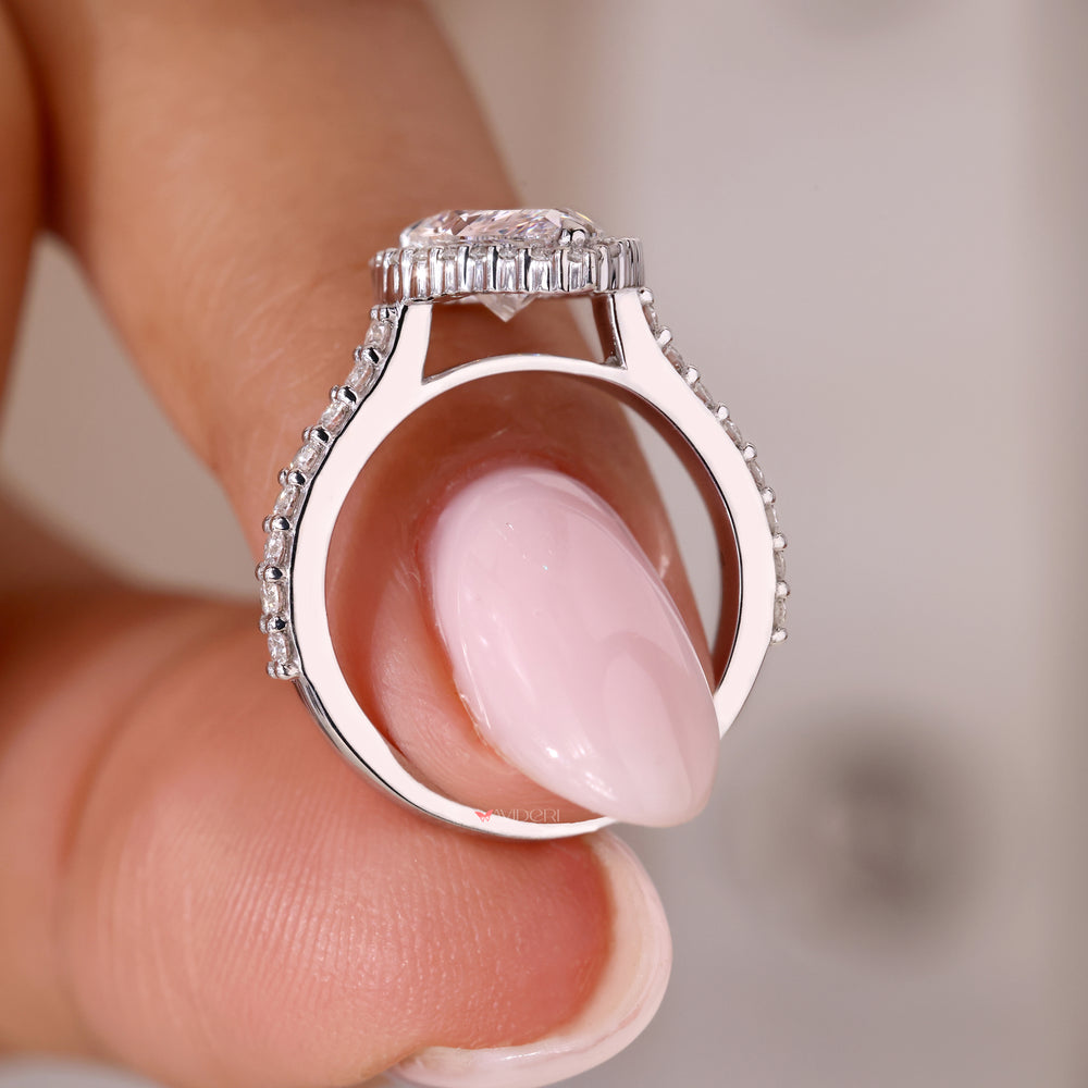 White gold engagement ring featuring a pear shaped diamond and a beautiful halo.
