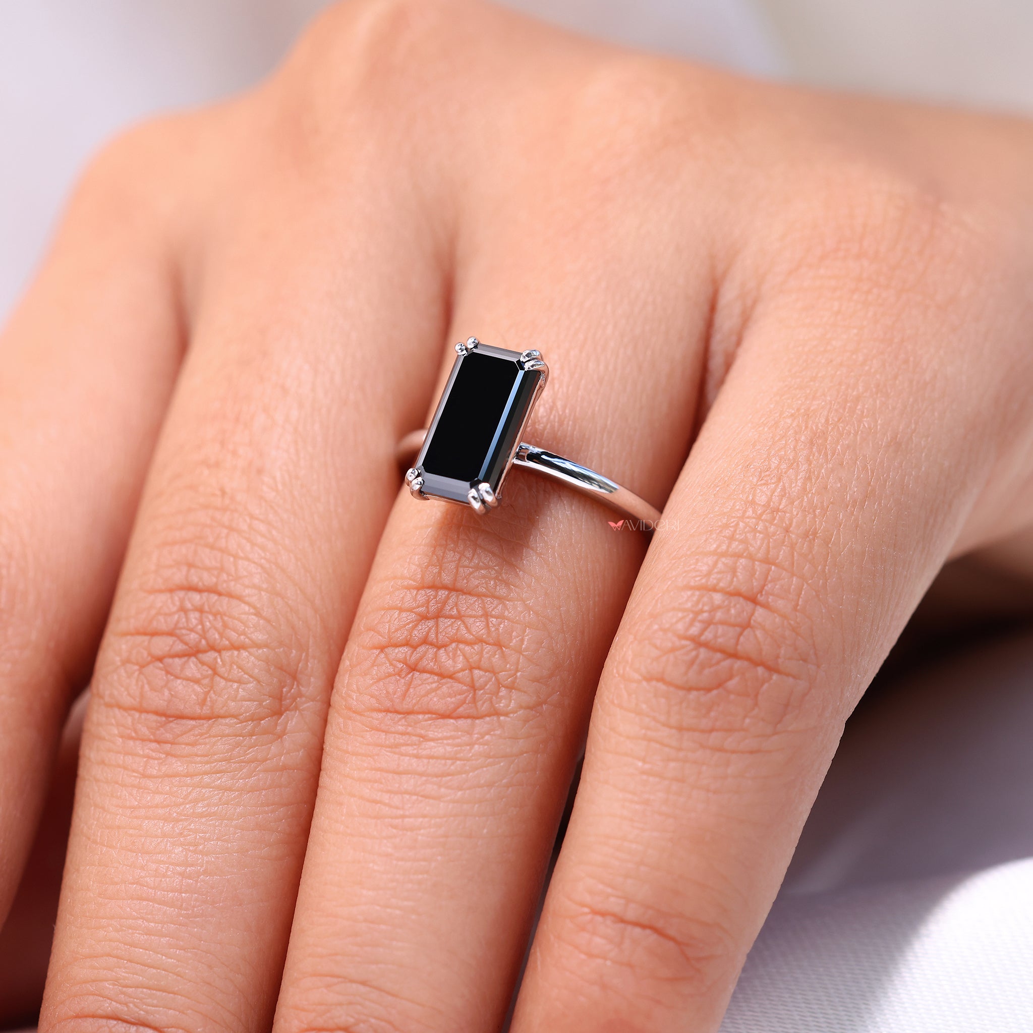 Emerald cut moissanite ring featuring a clean, modern look
