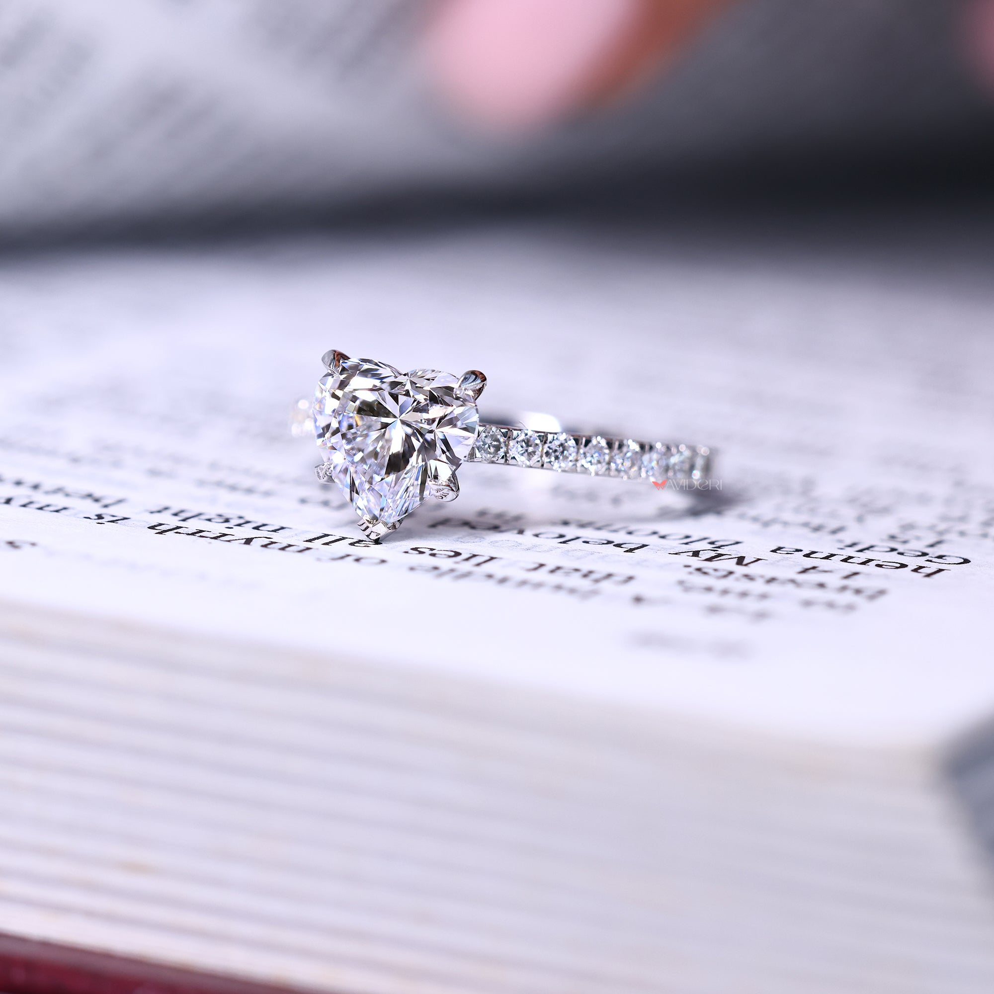 Cathedral setting engagement ring with heart shaped engagement ring.