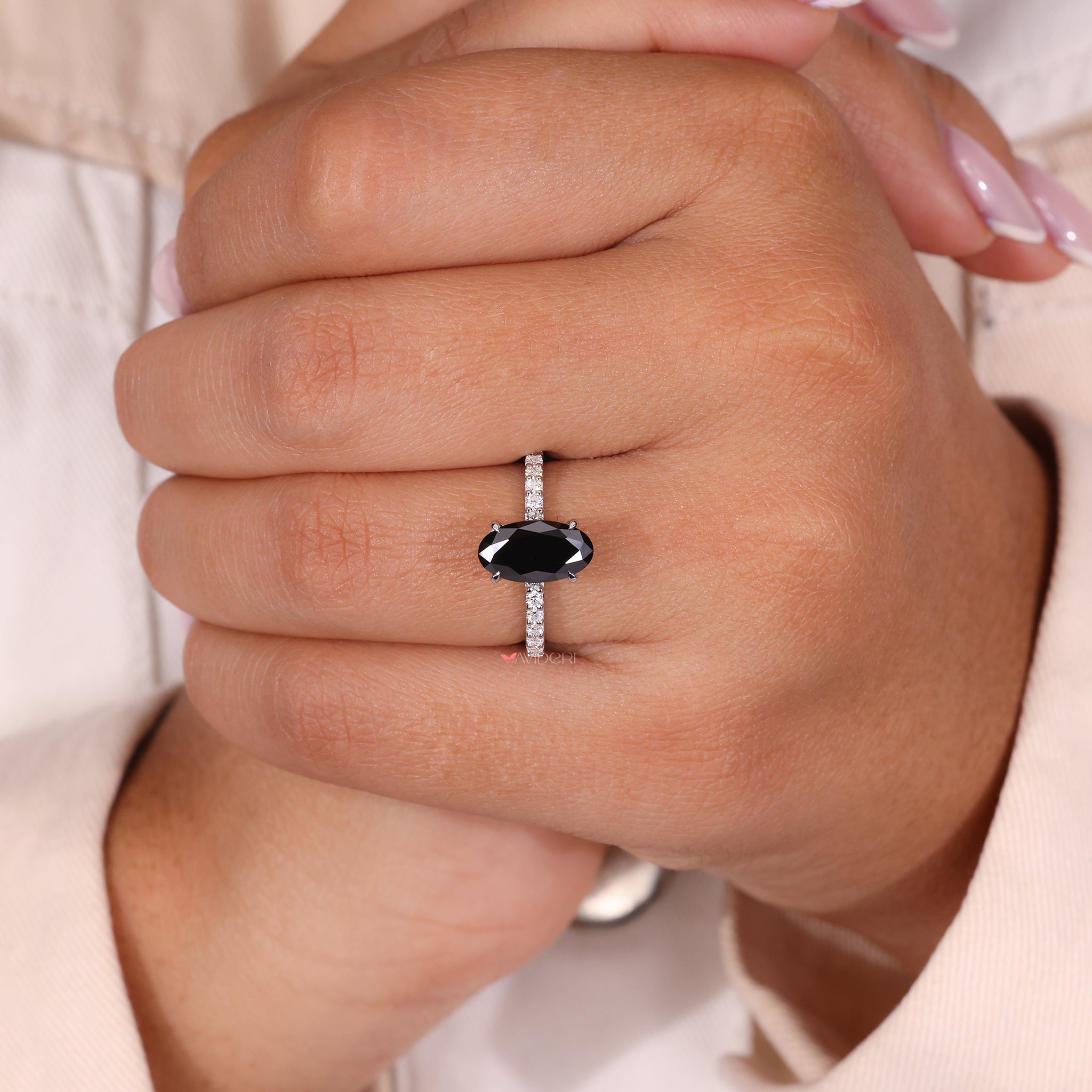 4 prong oval engagement ring with a brilliant oval-cut center stone.
