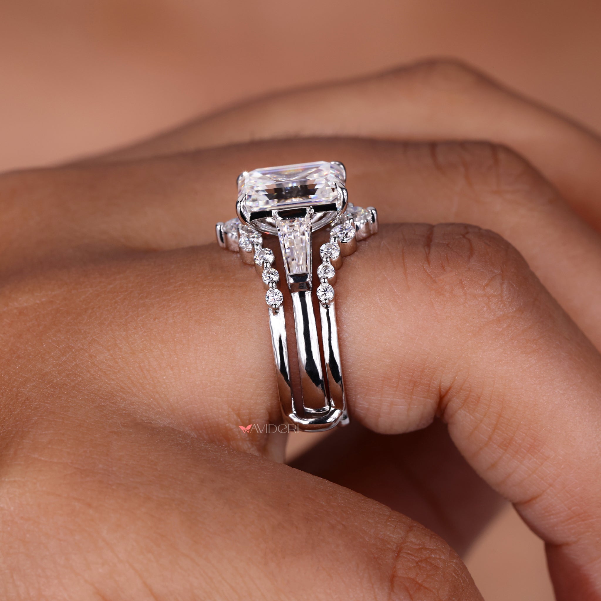 Emerald and tapered baguette cut engagement ring.