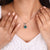 Moissanite solitaire pendant with a bold center stone.