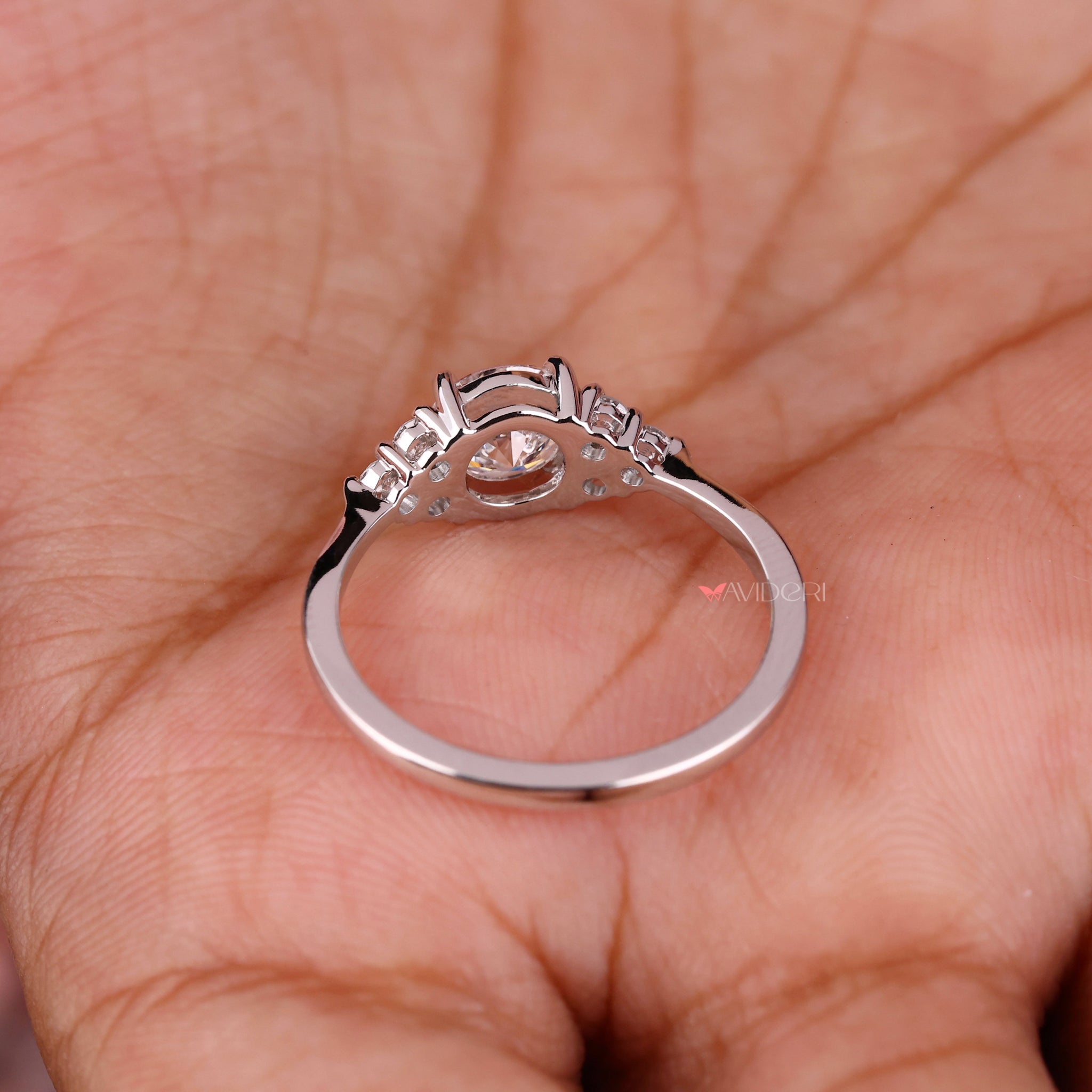 4 Prong Round Engagement Ring with a radiant center diamond.