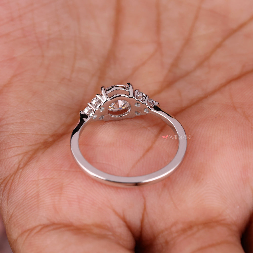 4 Prong Round Engagement Ring with a radiant center diamond.