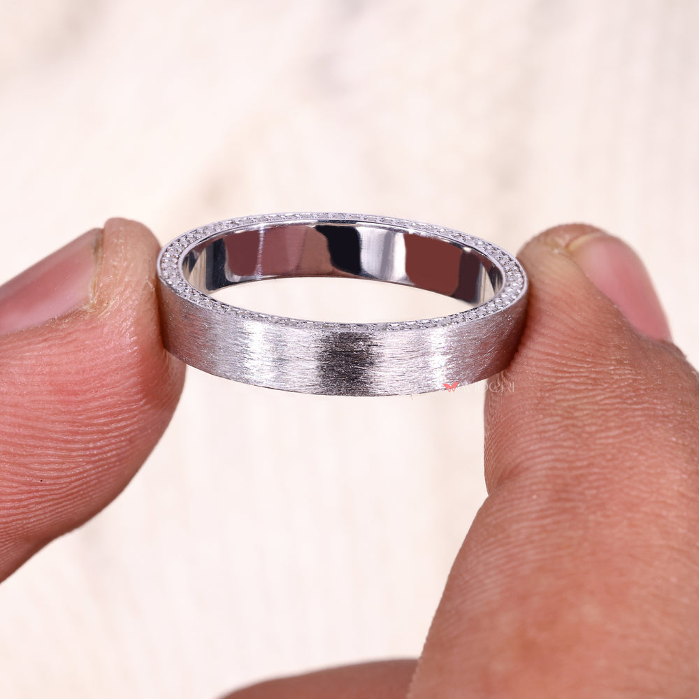 White gold ring with an eternity diamond design.
