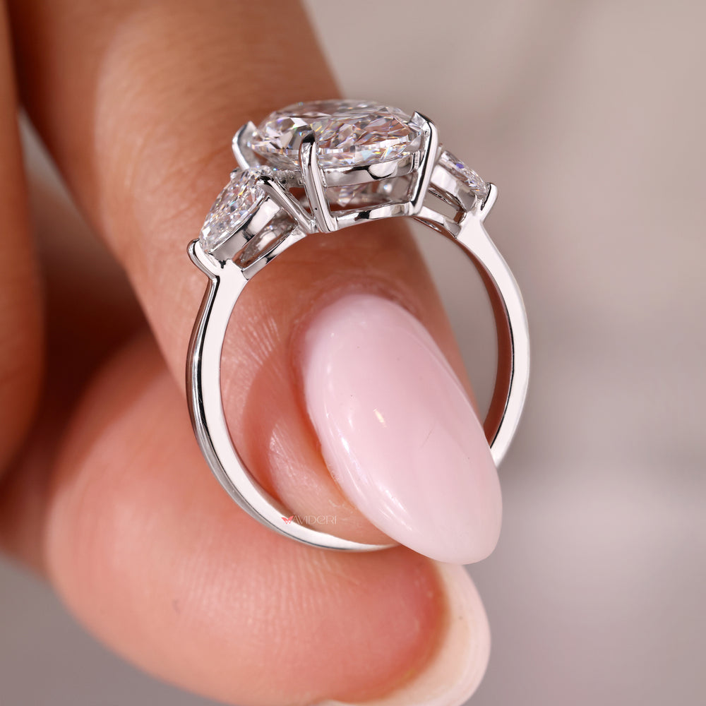 White gold ring with a three stone oval engagement ring for a timeless design.
