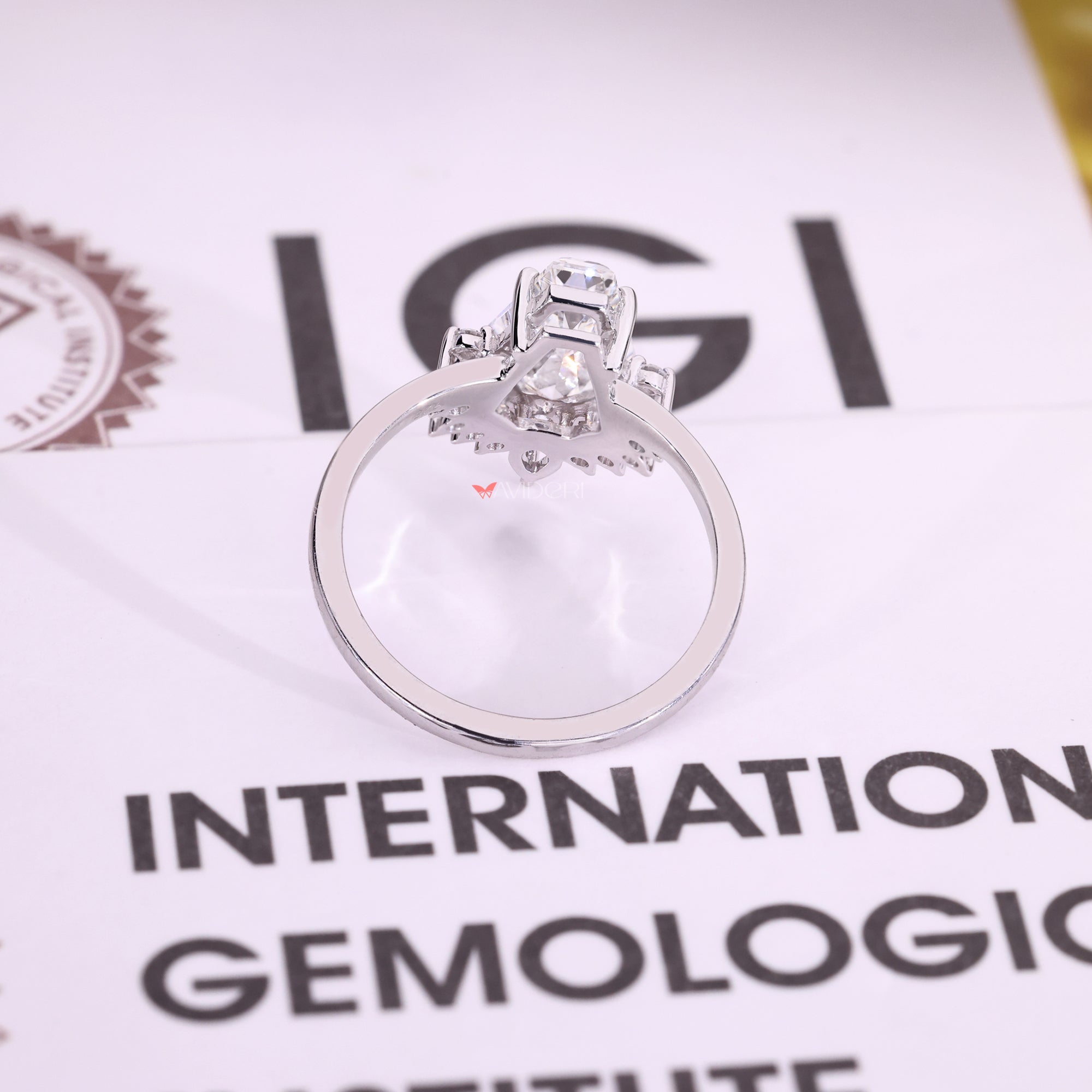 White gold ring with coffin cut center stone.