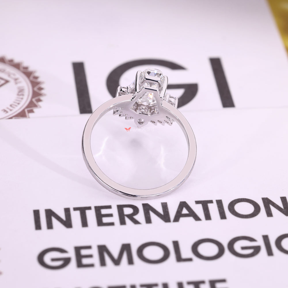 White gold ring with coffin cut center stone.