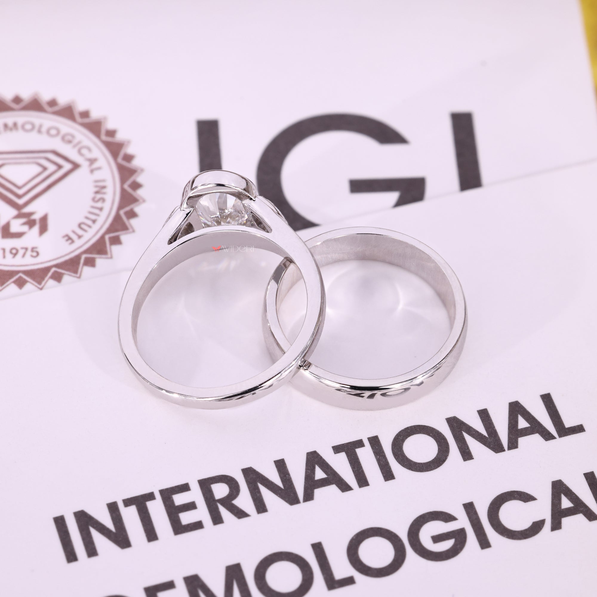 Tapered shank ring with cathedral setting.