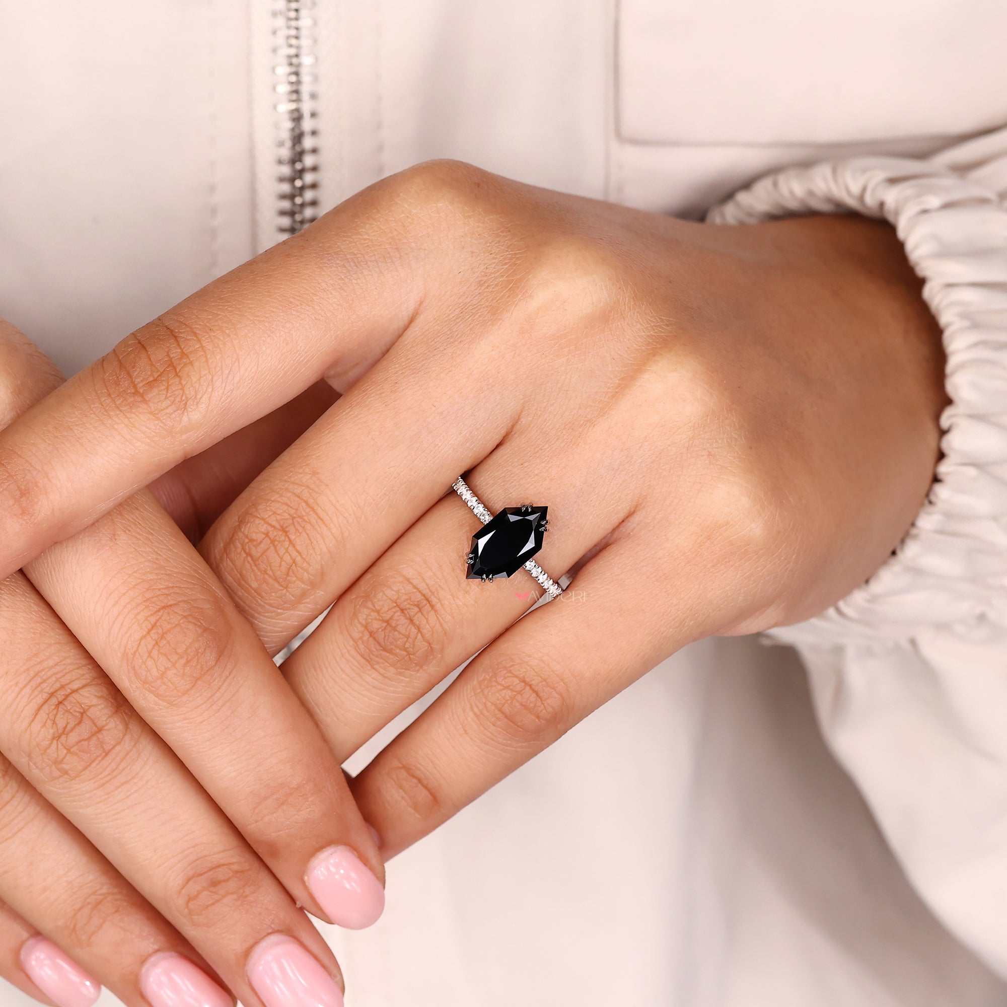 White gold ring featuring fine polished details.
