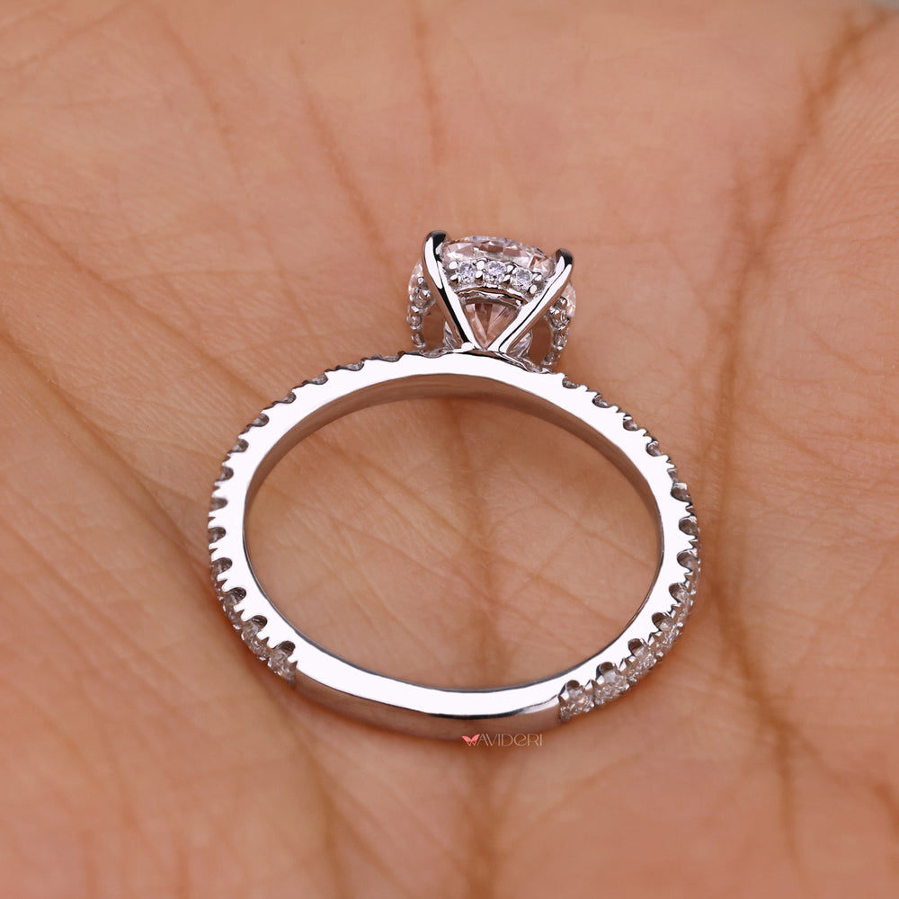 White Gold round cut diamond set in a pave setting, creating a timeless and sparkling hidden halo engagement ring.
