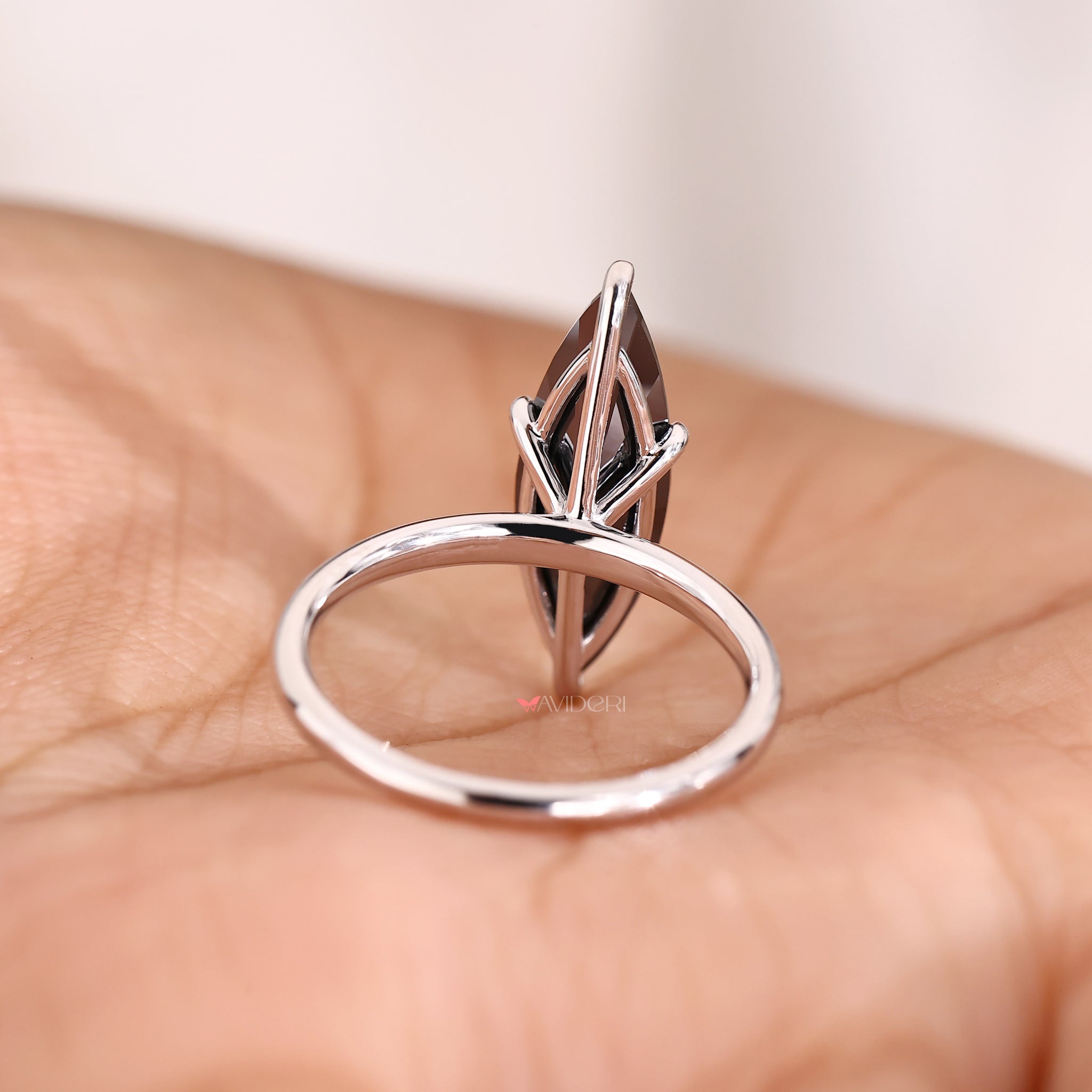 White gold engagement ring showcasing a marquise cut centerpiece.