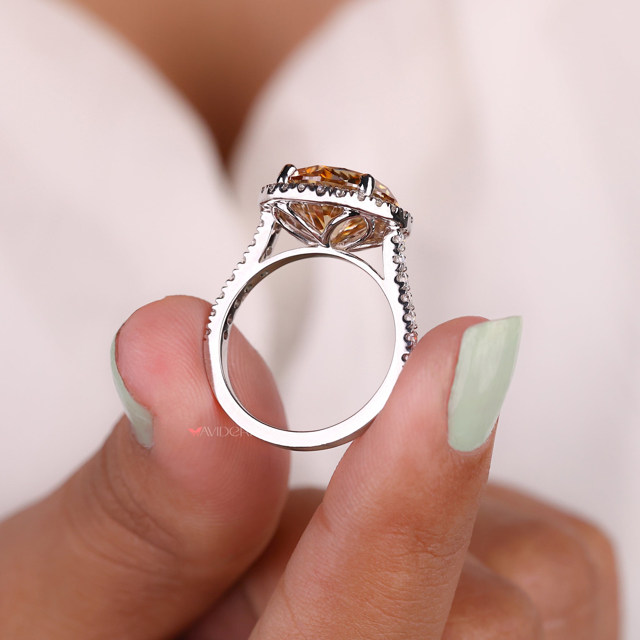 Round cut pave setting engagement ring in white gold.
