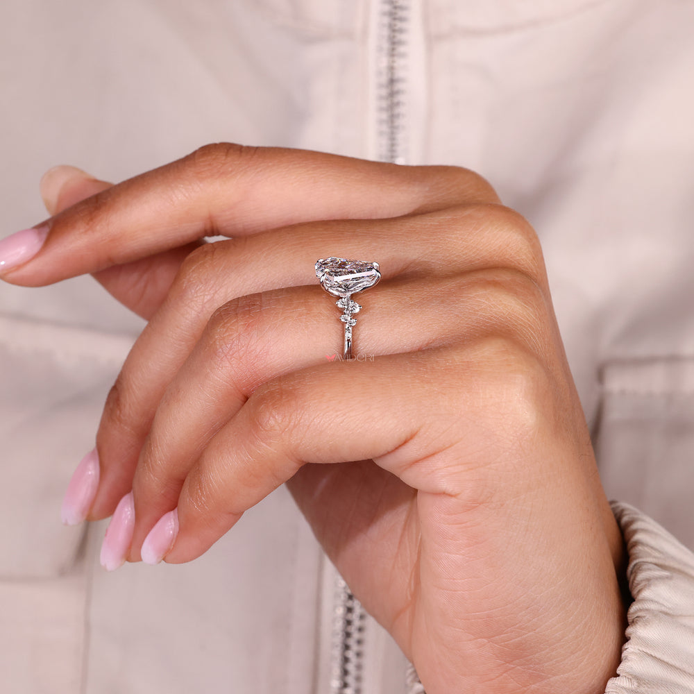 IGI certified coffin cut diamond ring with side stones.