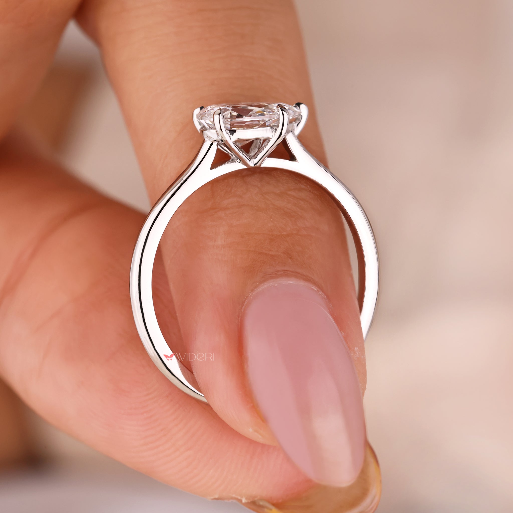 Cathedral Setting Ring with a pear-shaped diamond for a timeless design.