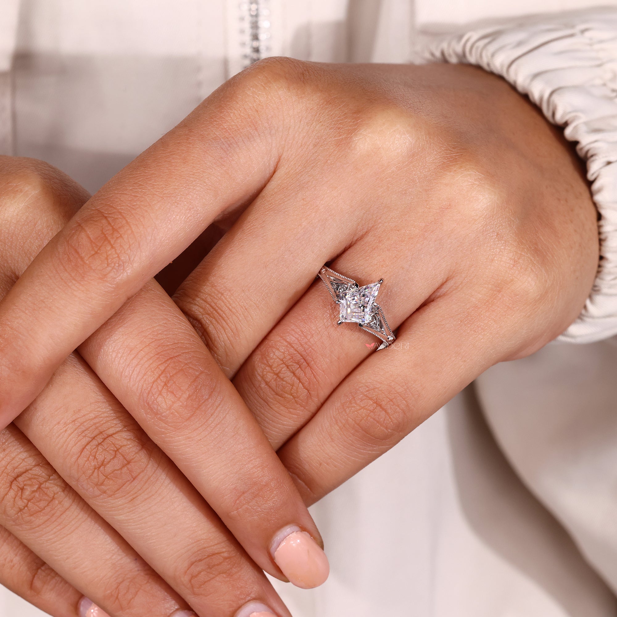 Six claw prong vintage style diamond engagement ring.